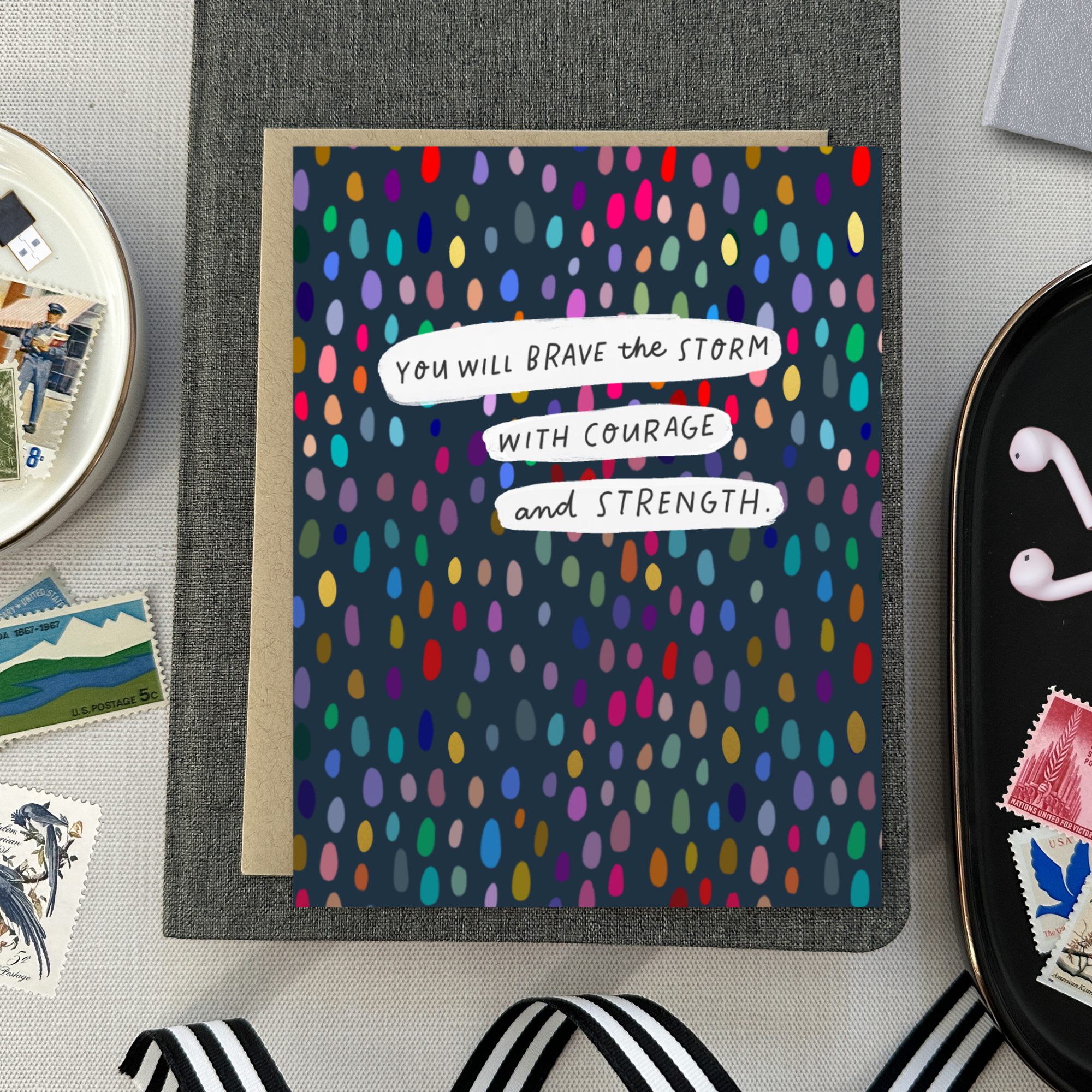 A friendship greeting card with a colorful dotted pattern and the text 'You will brave the storm with courage and strength' on it.