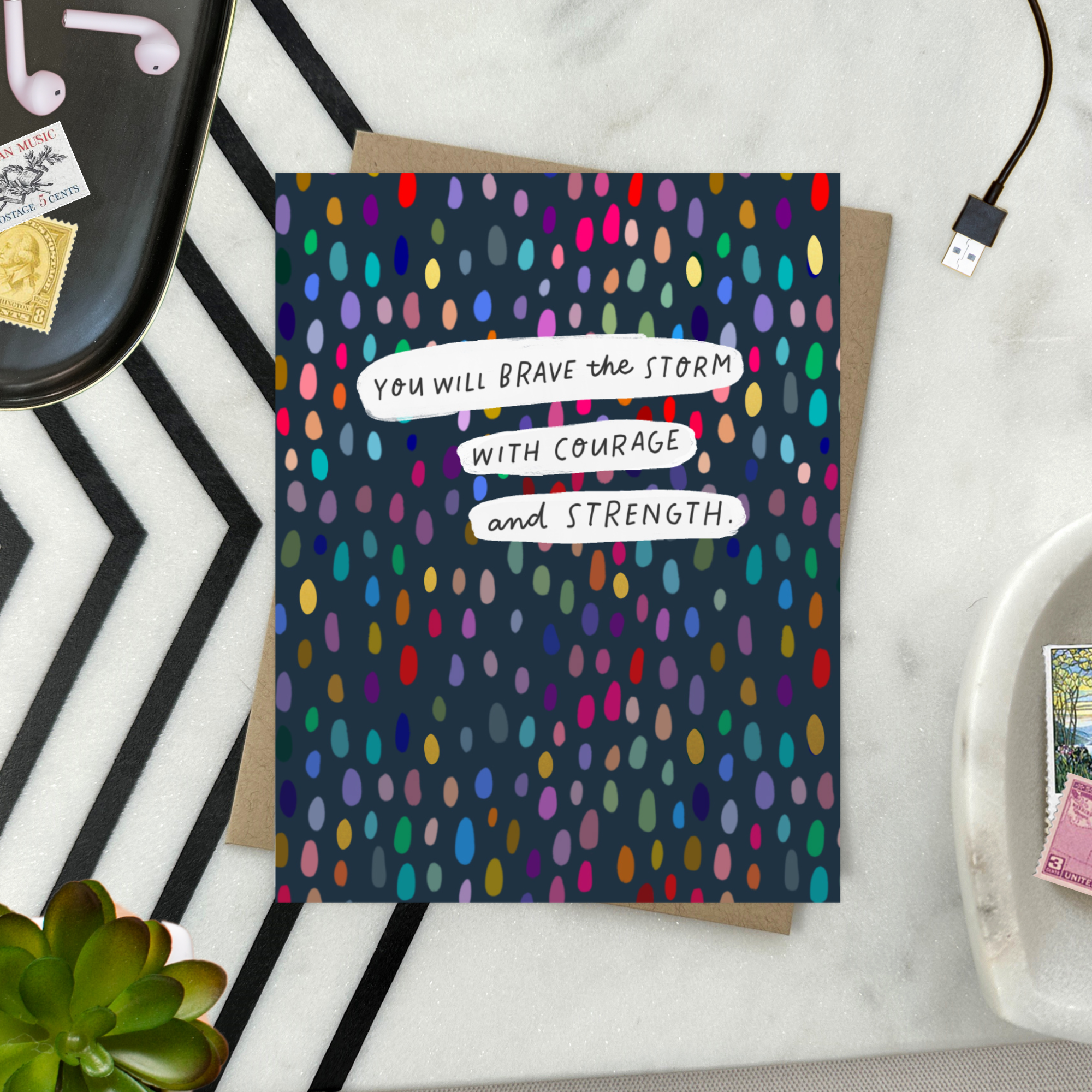 A friendship greeting card with a colorful dotted pattern and the text 'You will brave the storm with courage and strength' on it.
