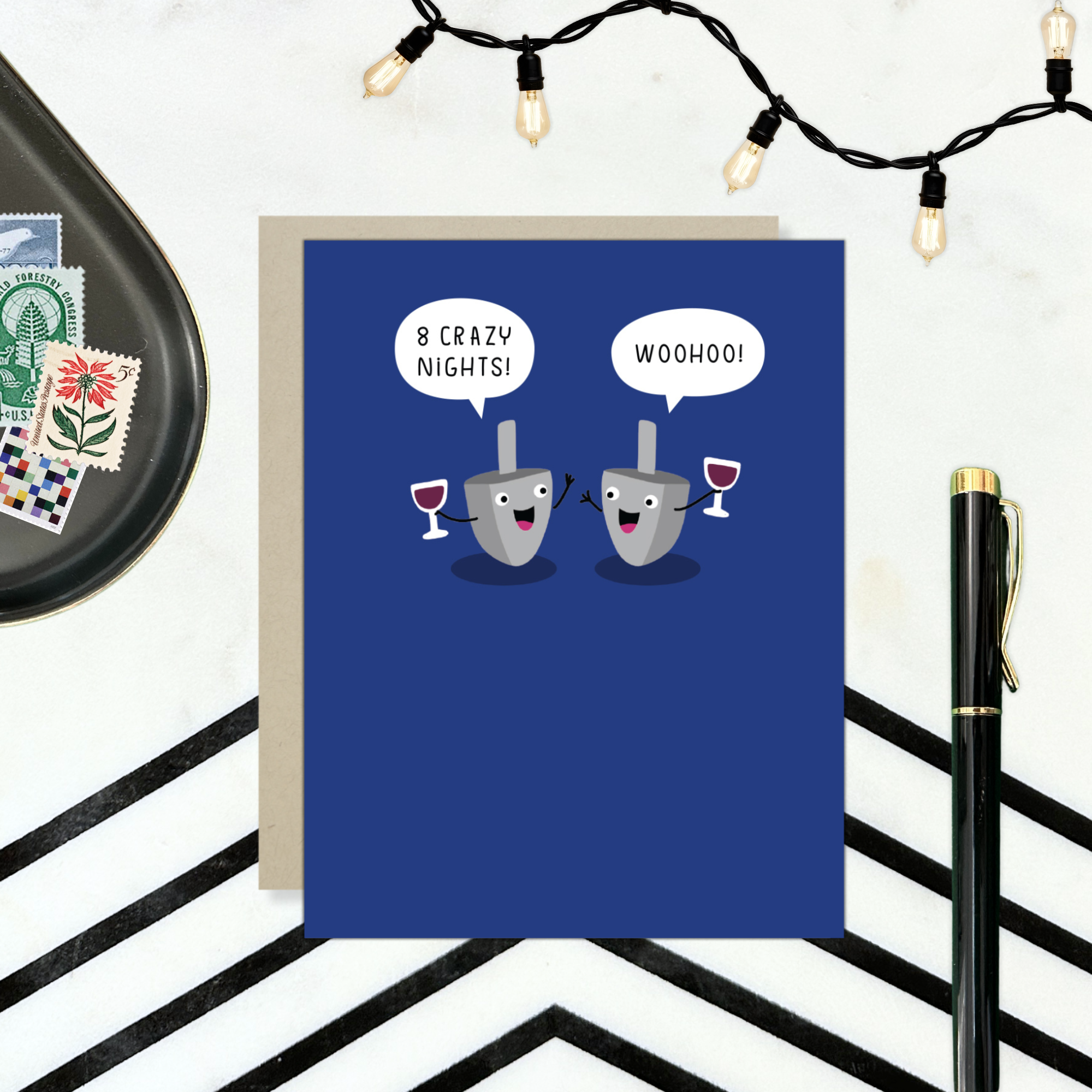 Hannukah greeting card with 2 dreidels drinking. One is saying '8 crazy nights' the other says 'woohoo!'