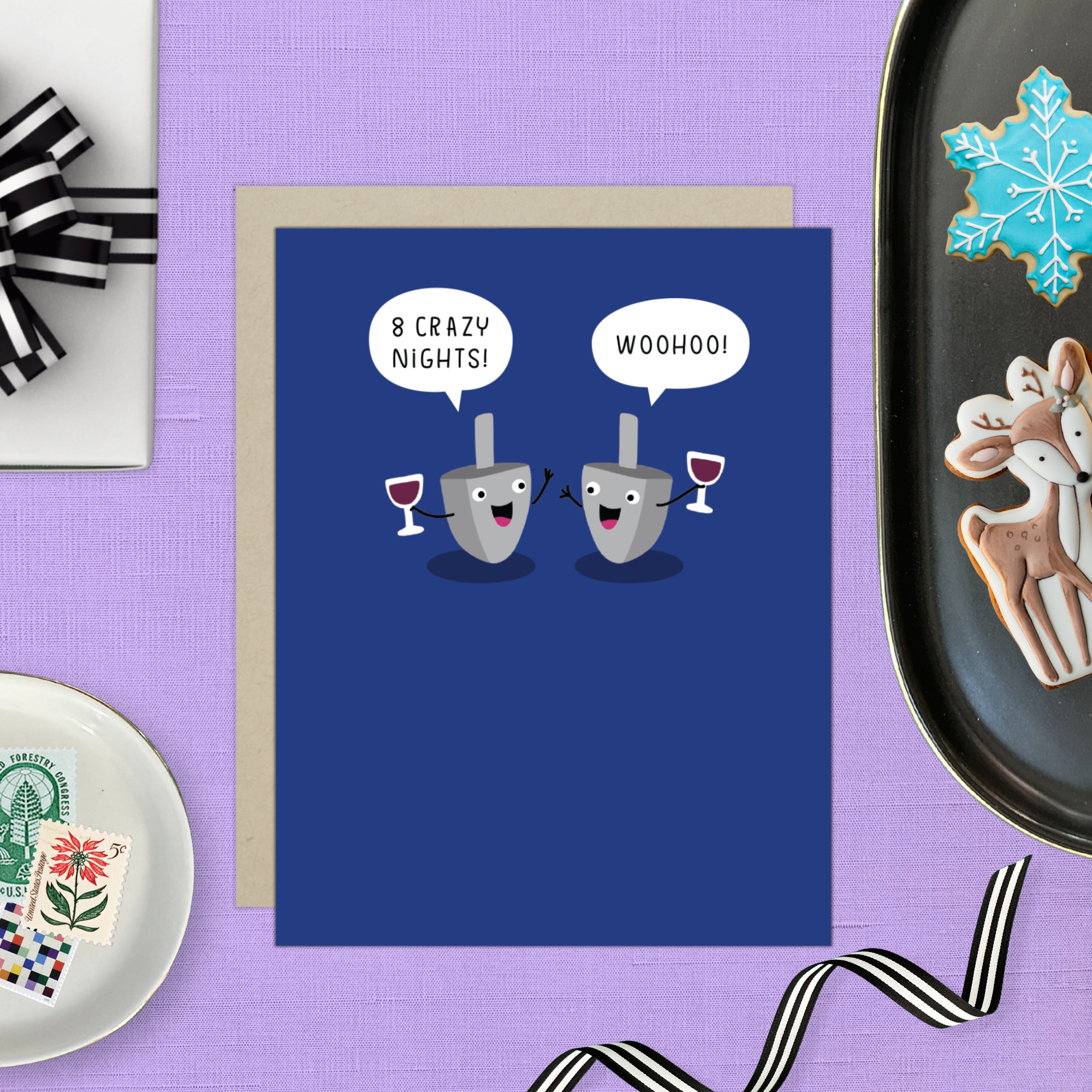 Hannukah greeting card with 2 dreidels drinking. One is saying '8 crazy nights' the other says 'woohoo!'
