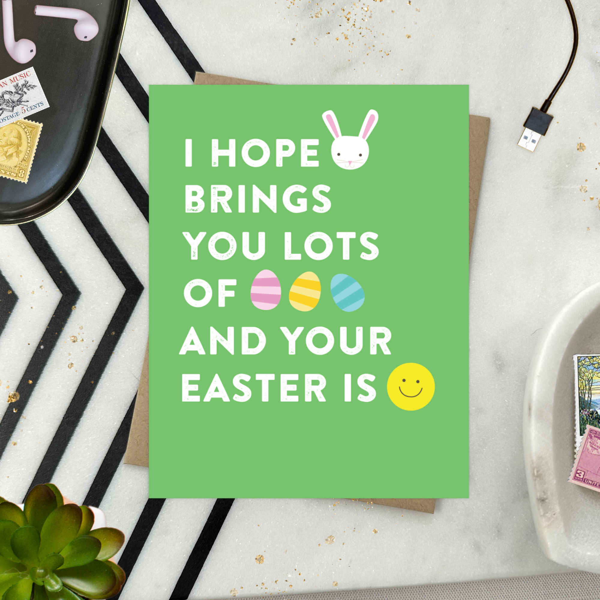 easter greeting card with text 'I hope your (bunny emoji) brings you lots of (egg emoji) and your easter is (smile emoji'