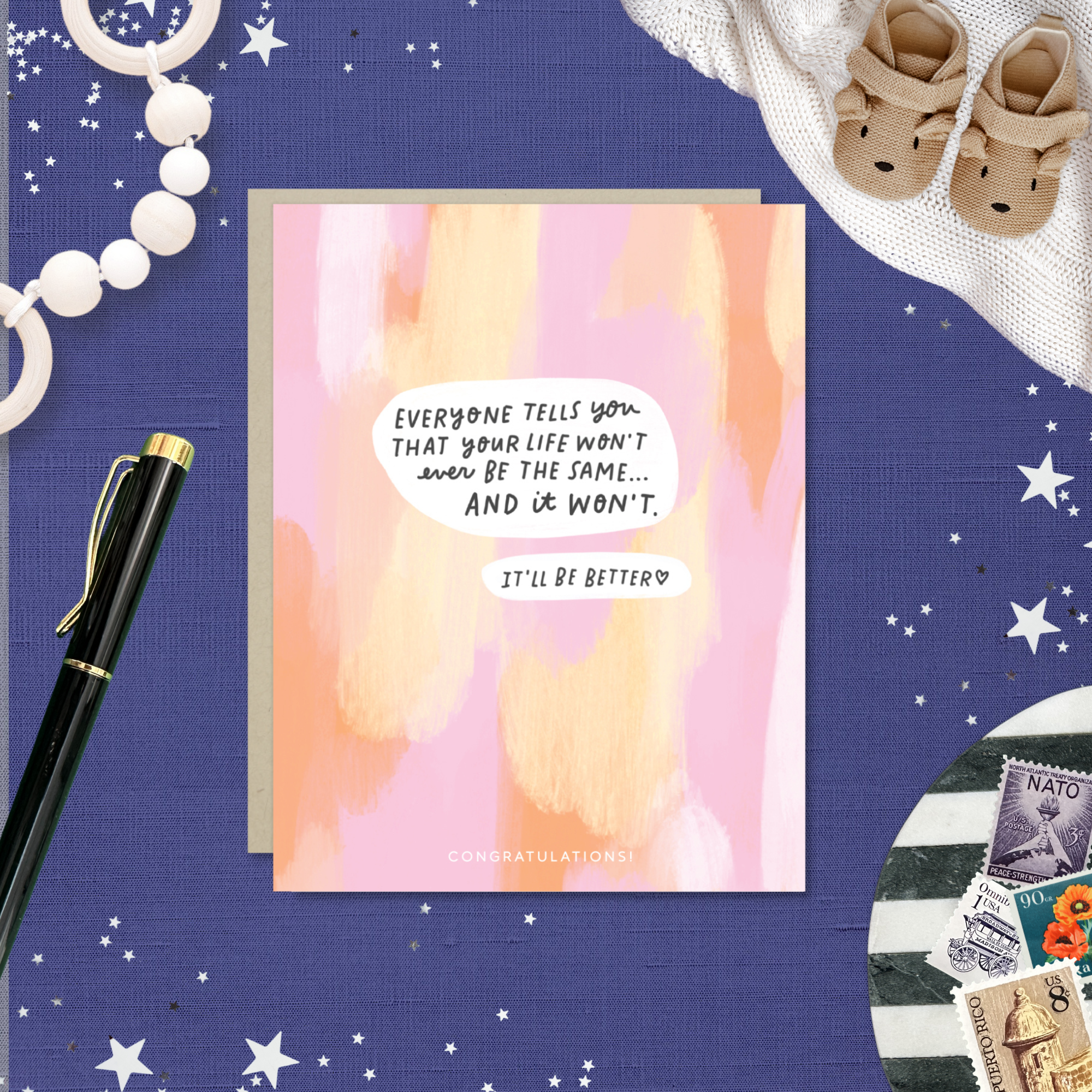 Baby greeting card with paint smear background and 'everyone tells you that your life won't ever be the same...' text