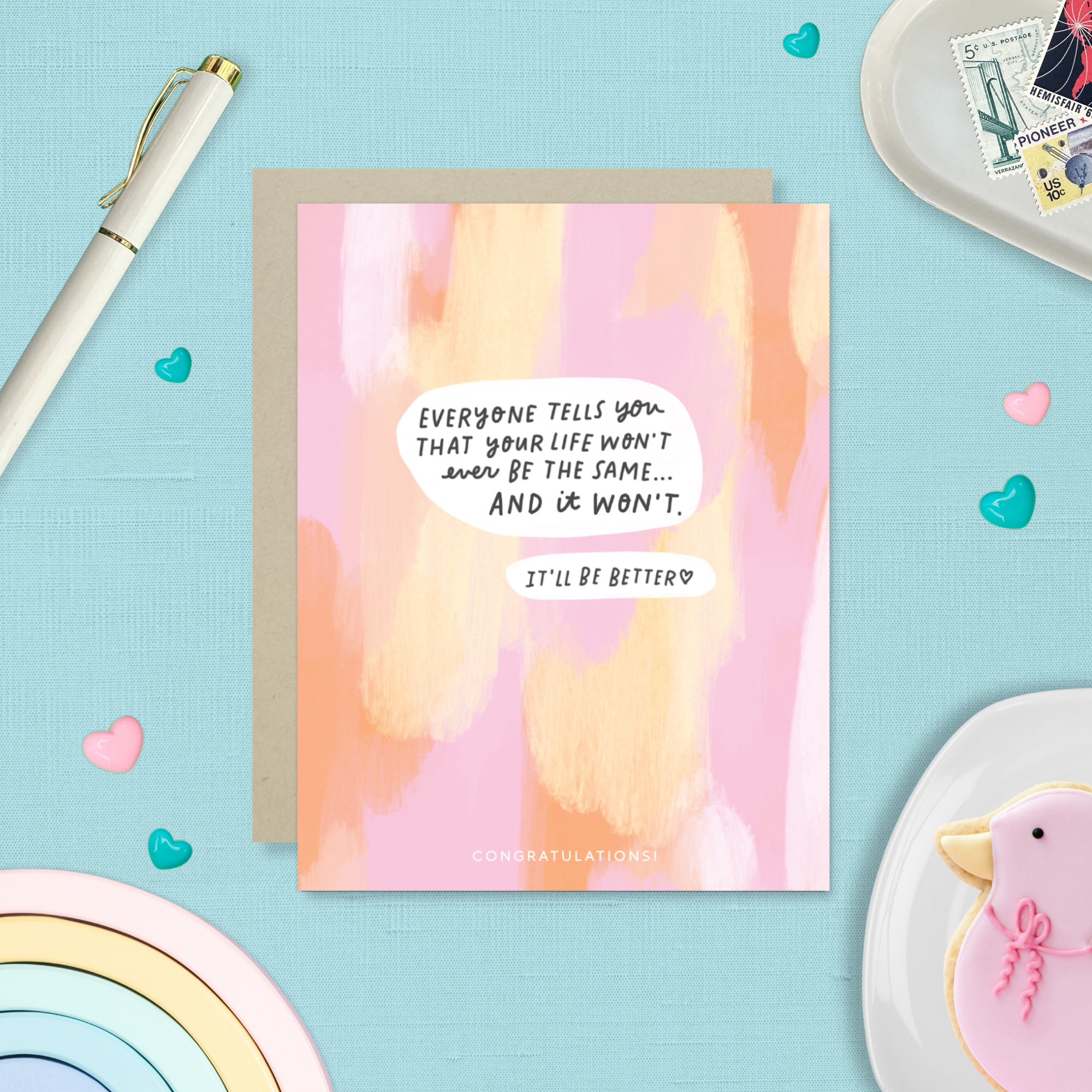 Baby greeting card with paint smear background and 'everyone tells you that your life won't ever be the same...' text