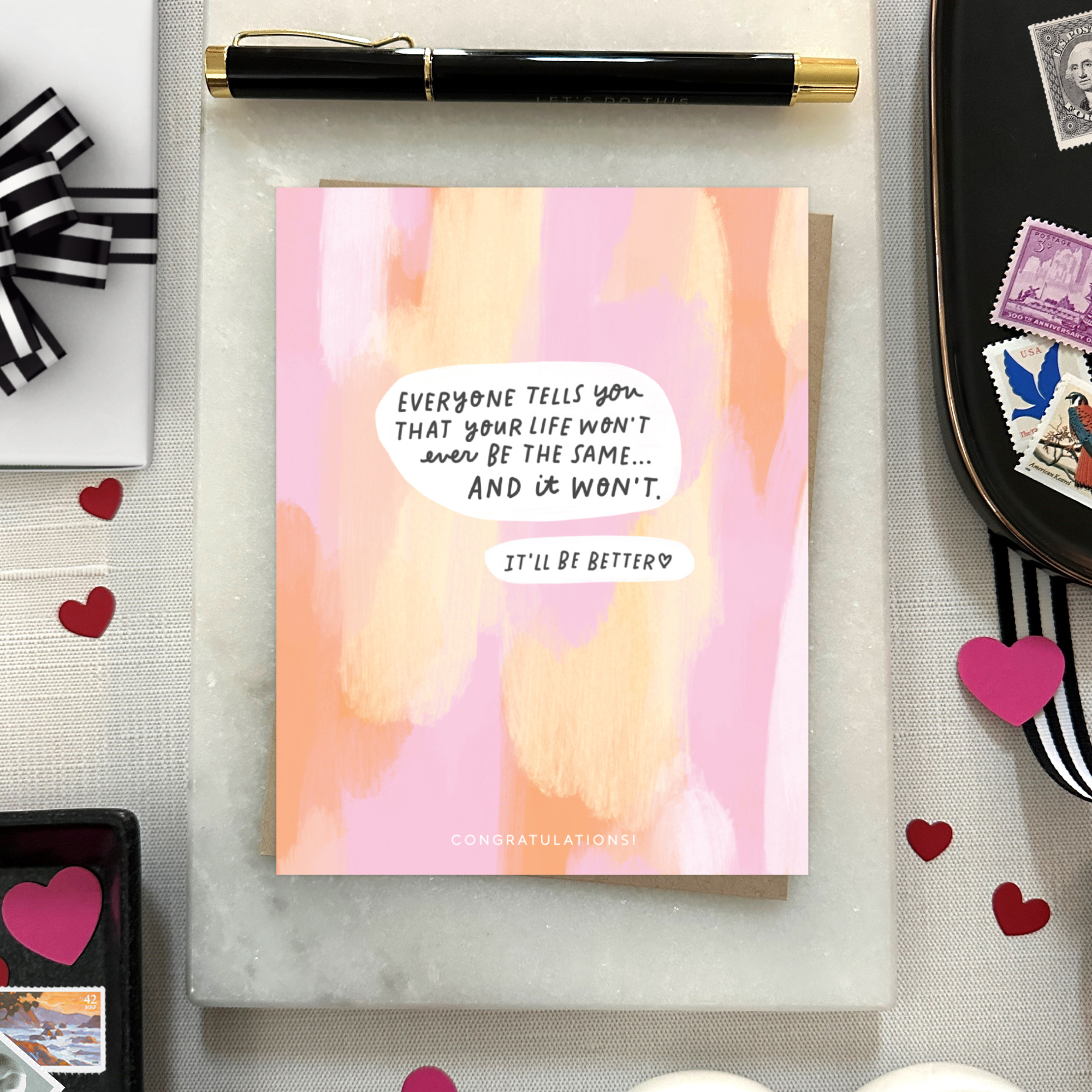 Baby greeting card with paint smear background and 'everyone tells you that your life won't ever be the same...' text