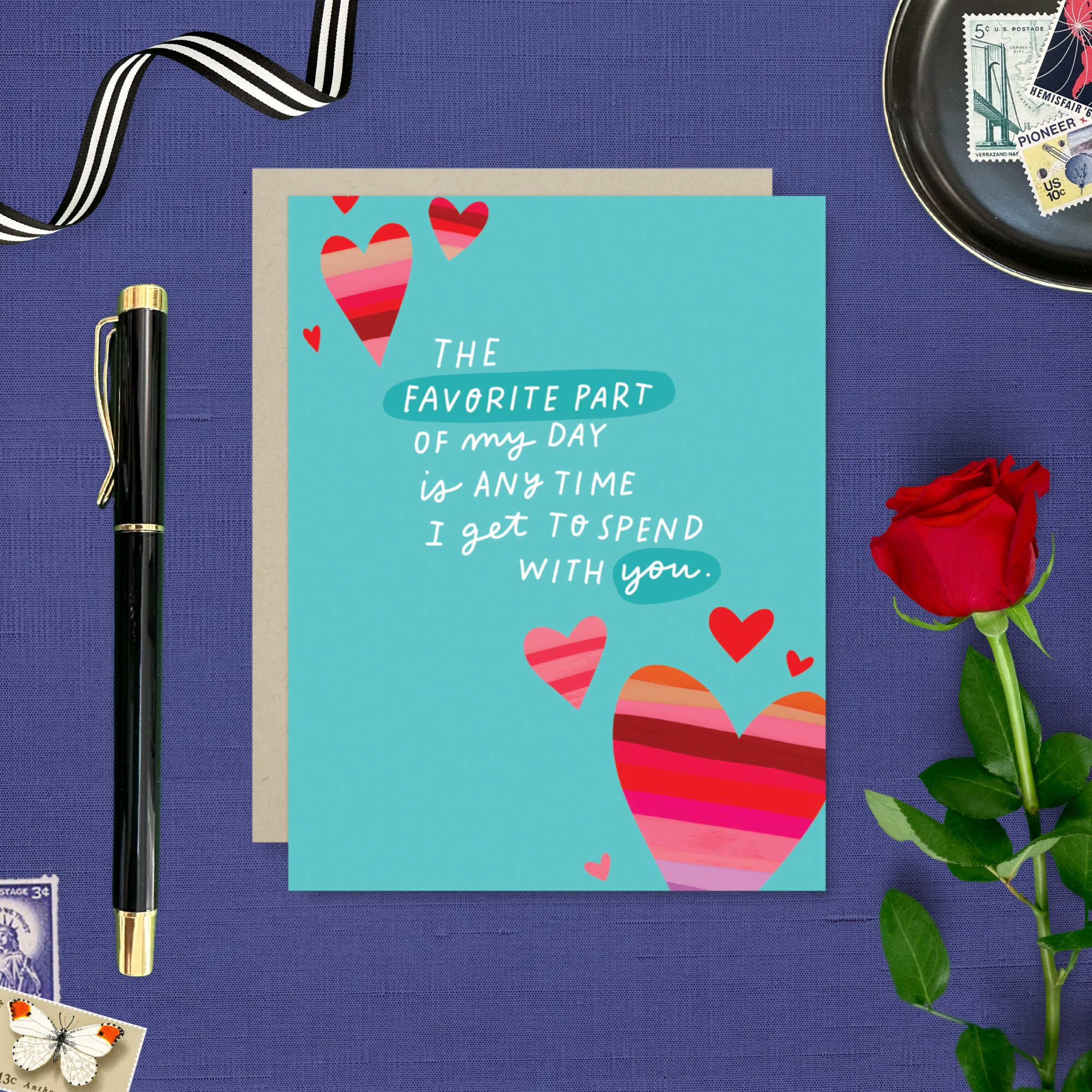 A wedding/anniversary greeting card with hand-lettered text expressing love, surrounded by heart designs.