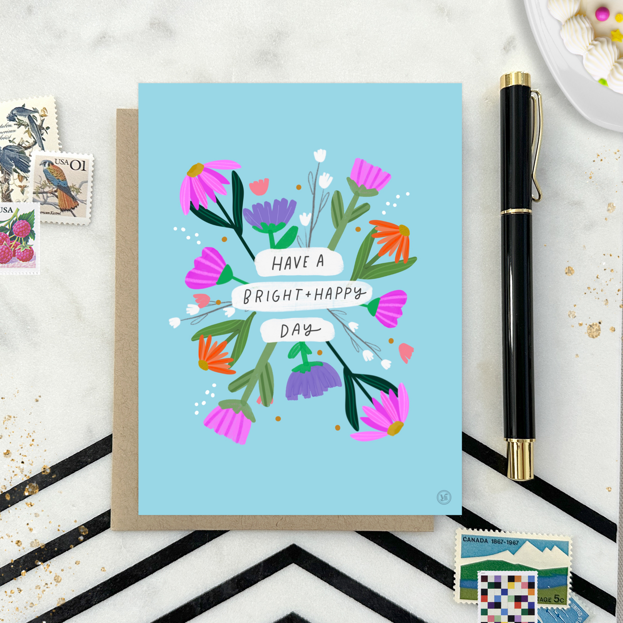 A colorful birthday greeting card with illustrated flowers and the text 'HAVE A BRIGHT & HAPPY DAY' on it