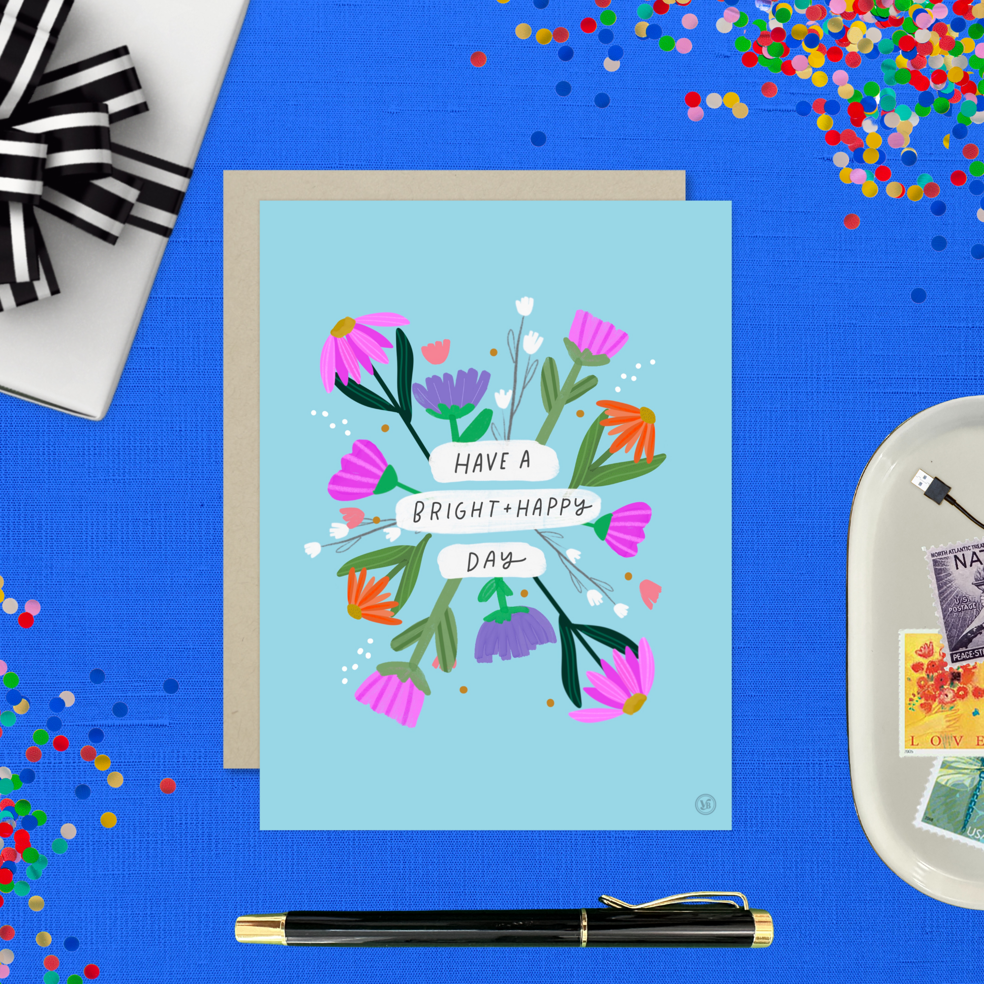 A colorful birthday greeting card with illustrated flowers and the text 'HAVE A BRIGHT & HAPPY DAY' on it