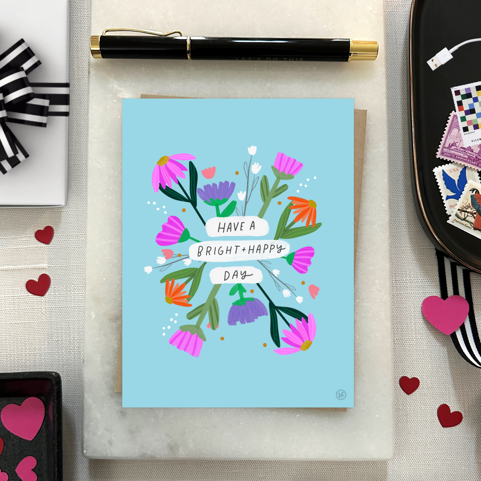 A colorful birthday greeting card with illustrated flowers and the text 'HAVE A BRIGHT & HAPPY DAY' on it