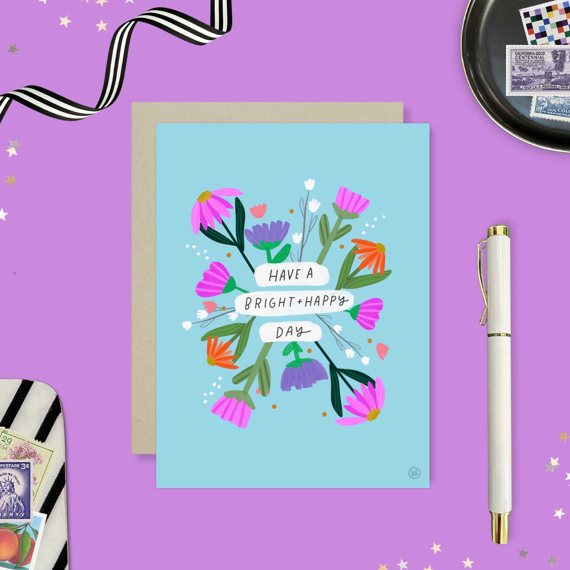 A colorful birthday greeting card with illustrated flowers and the text 'HAVE A BRIGHT & HAPPY DAY' on it