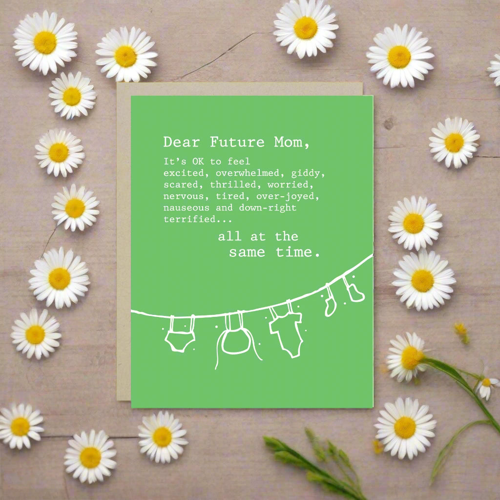 Baby greeting card with clothes hanging and 'dear future mom...' text