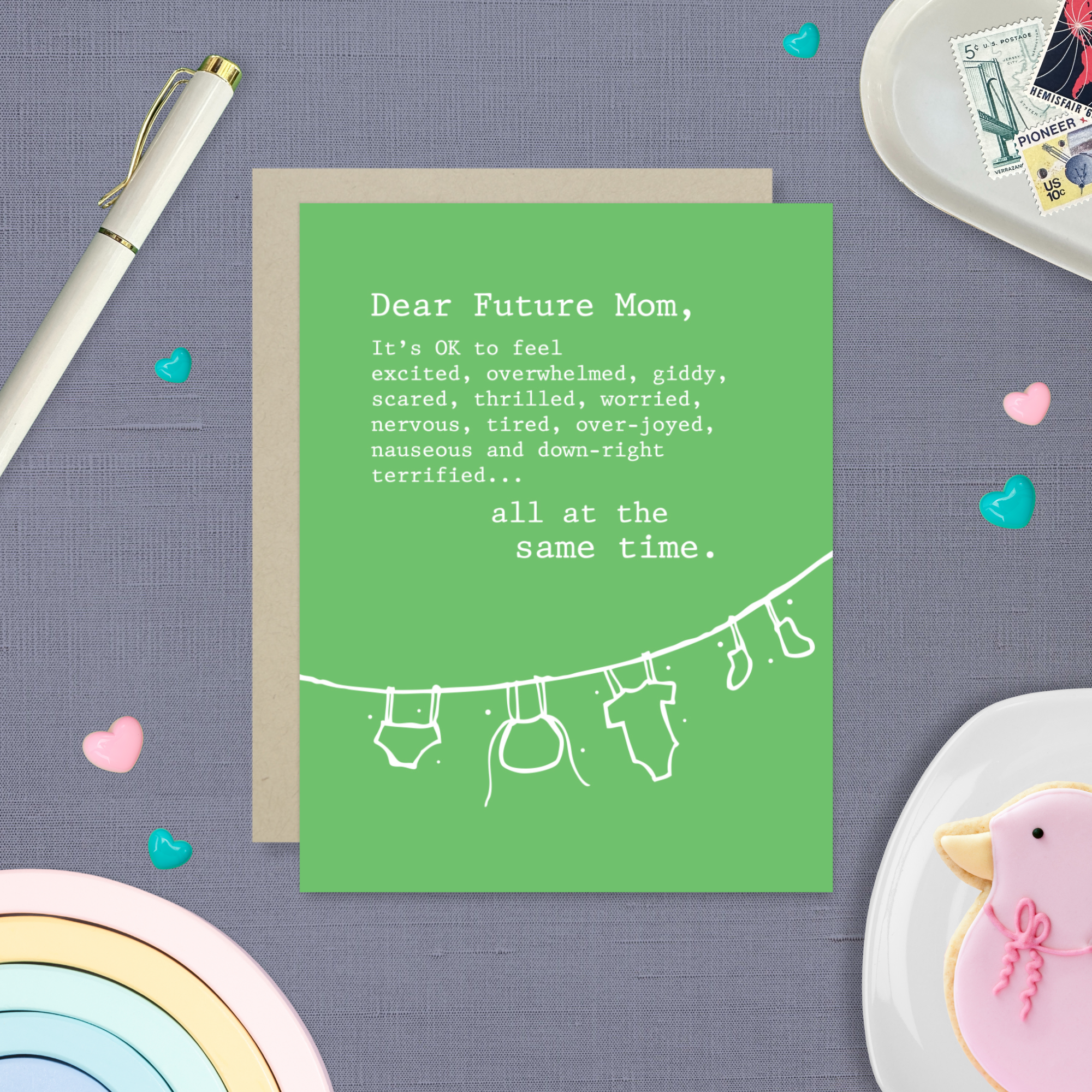 Baby greeting card with clothes hanging and 'dear future mom...' text