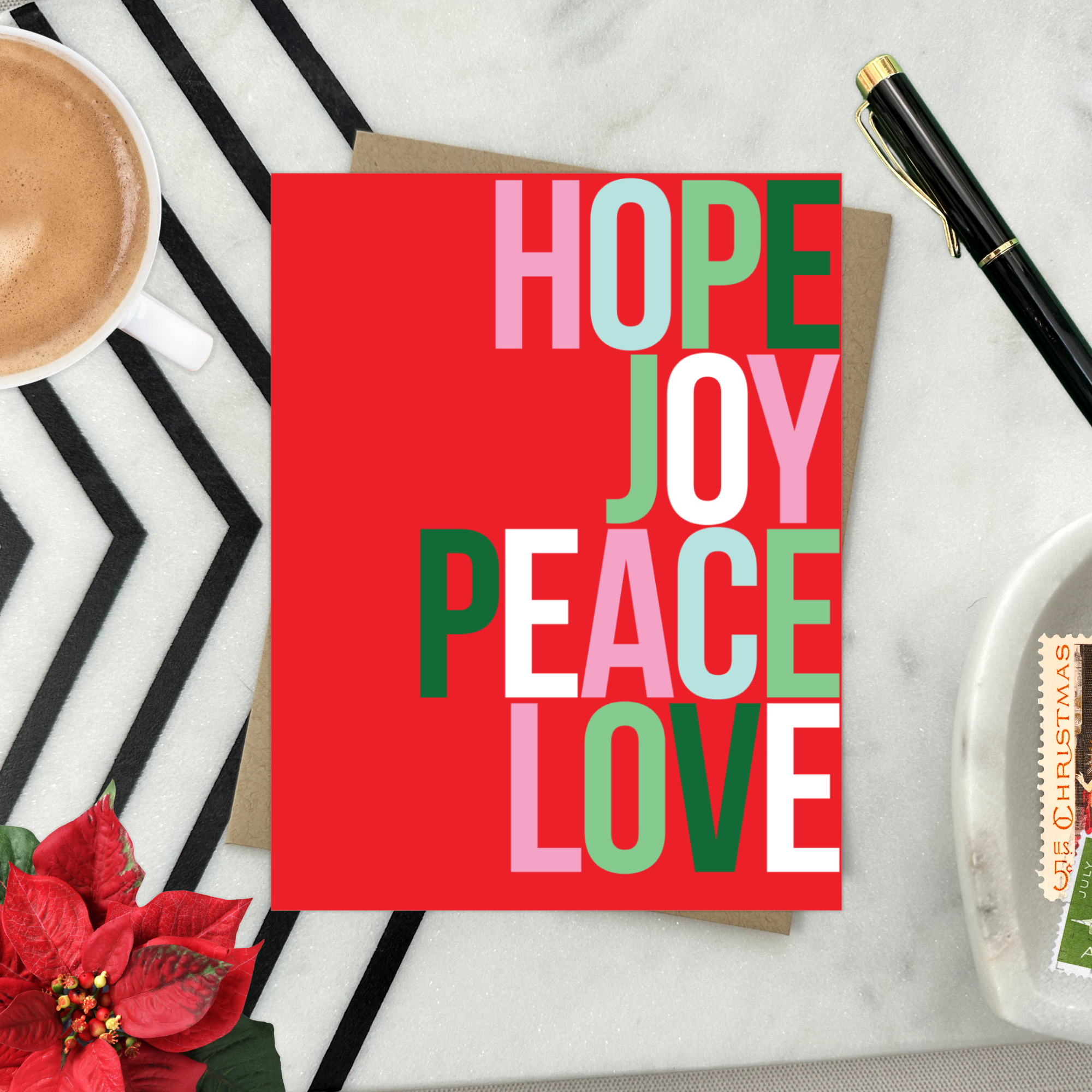 A red holiday greeting card with the words 'HOPE, JOY, PEACE, LOVE' stacked in a graphic design.