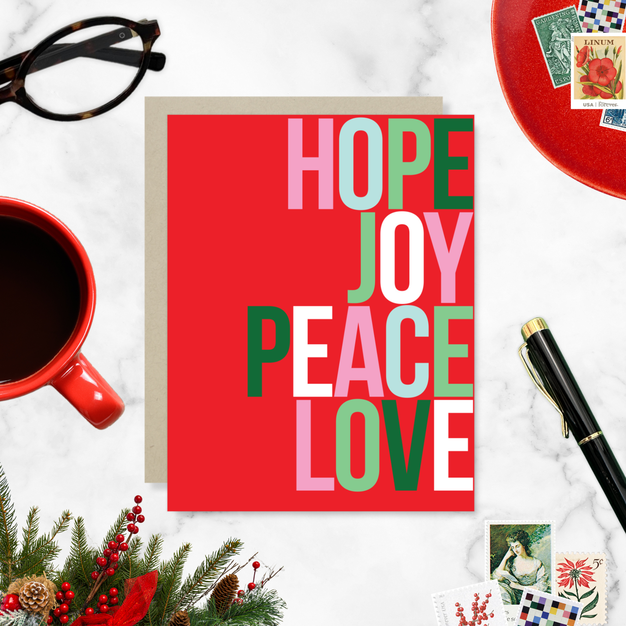 A red holiday greeting card with the words 'HOPE, JOY, PEACE, LOVE' stacked in a graphic design.