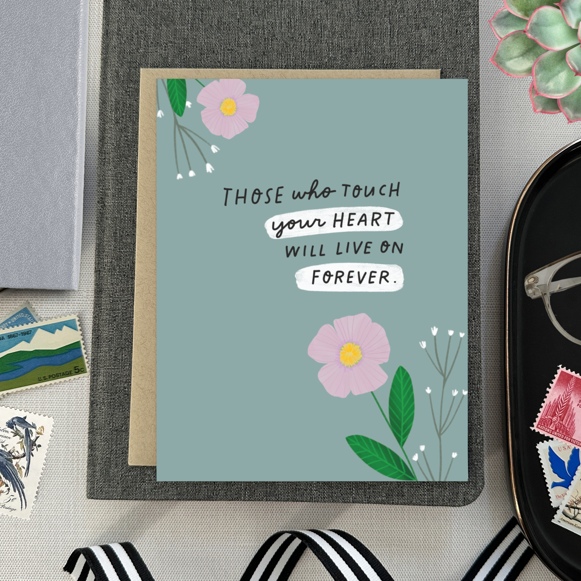 Sympathy greeting card with 2 flowers and 'those who touch your heart will live on forever' text