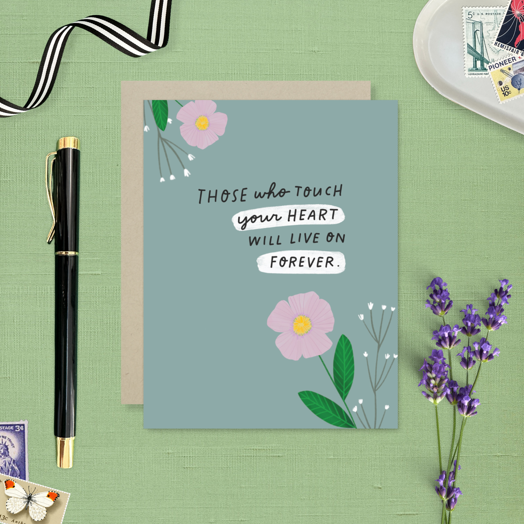 Sympathy greeting card with 2 flowers and 'those who touch your heart will live on forever' text