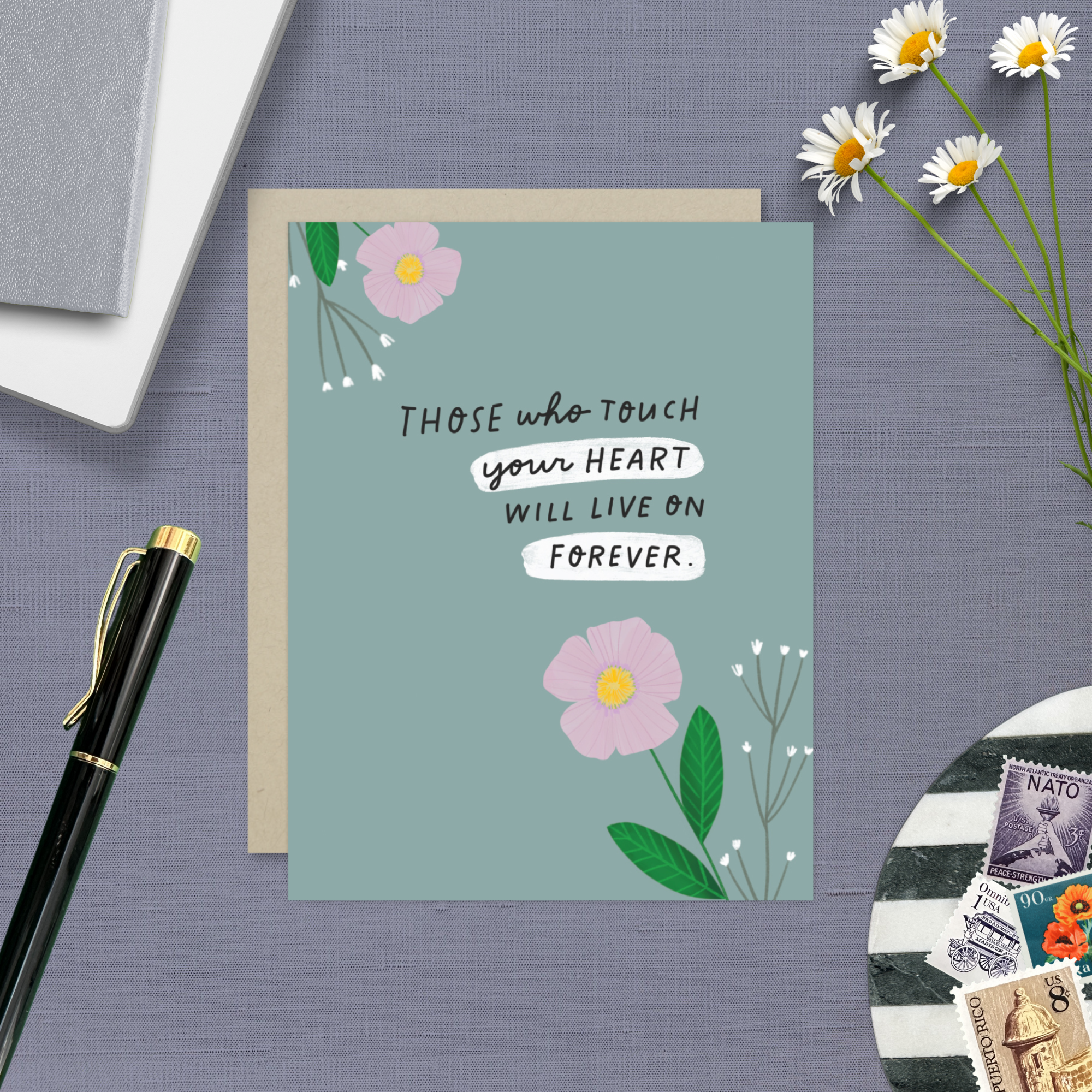 Sympathy greeting card with 2 flowers and 'those who touch your heart will live on forever' text