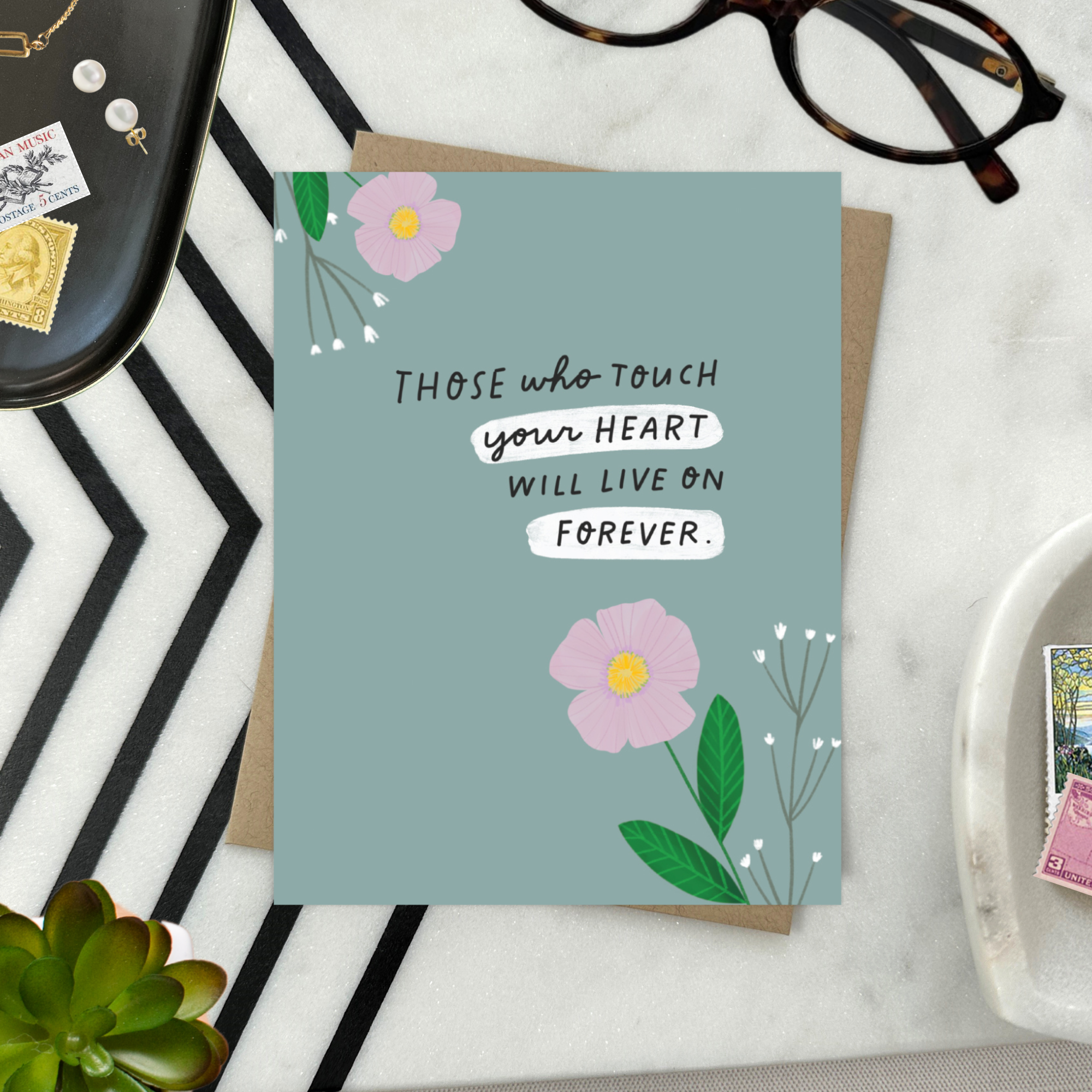 Sympathy greeting card with 2 flowers and 'those who touch your heart will live on forever' text