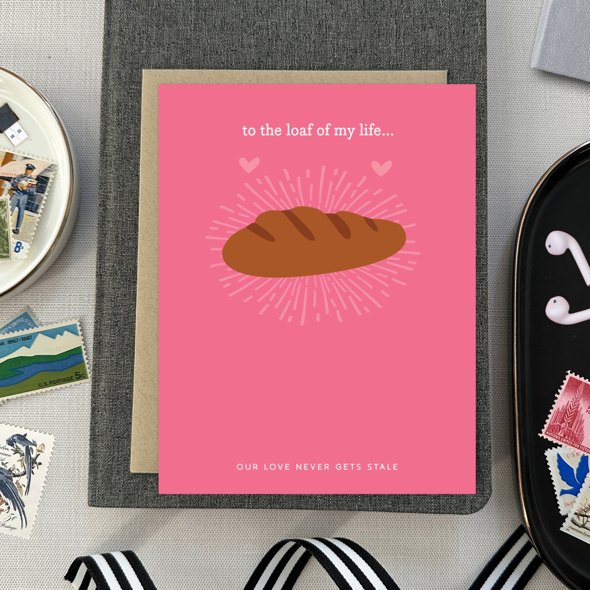 A Valentine's day greeting card with a illustration of a loaf of bread and the text 'to the loaf of my life... Our love never gets stale.'