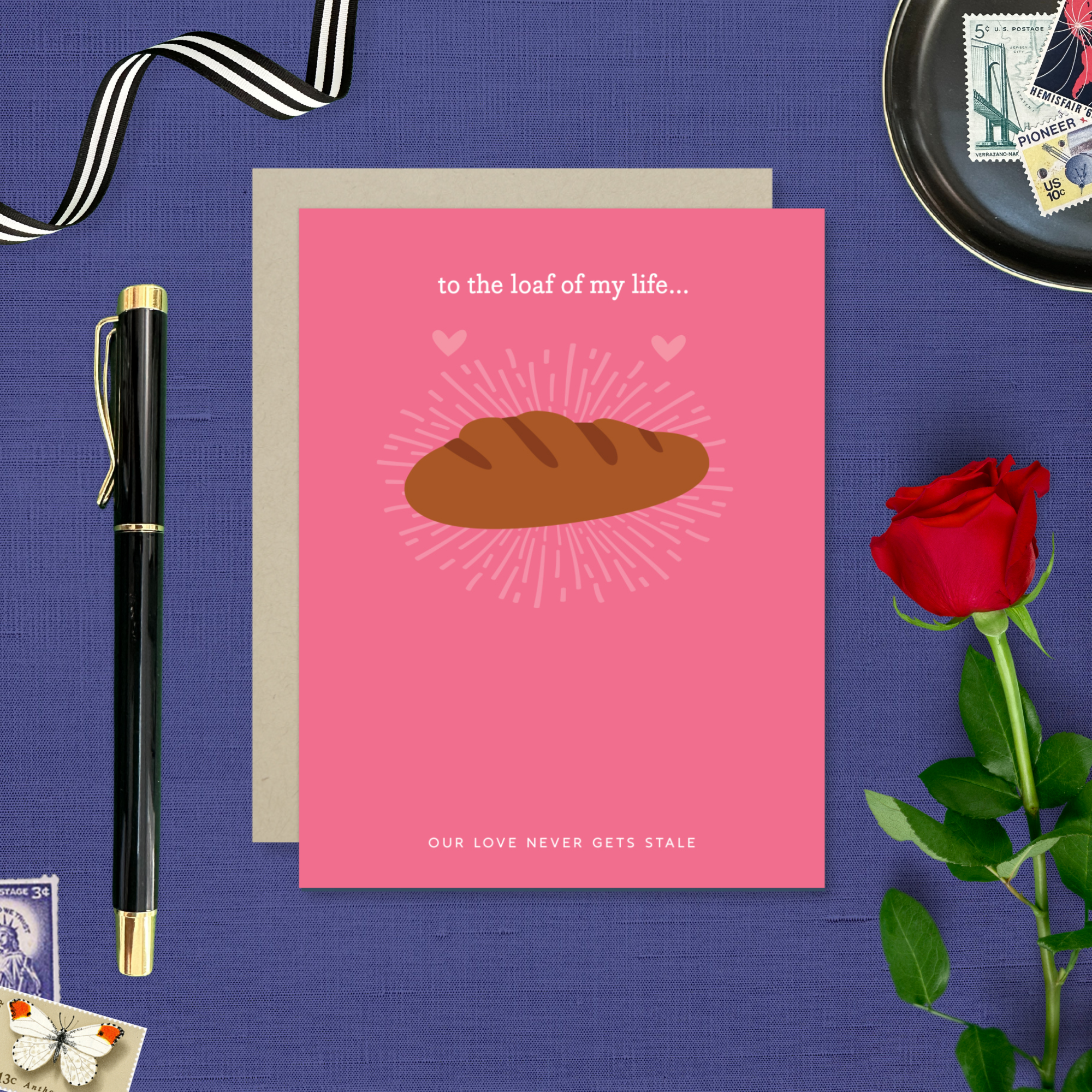 A Valentine's day greeting card with a illustration of a loaf of bread and the text 'to the loaf of my life... Our love never gets stale.'