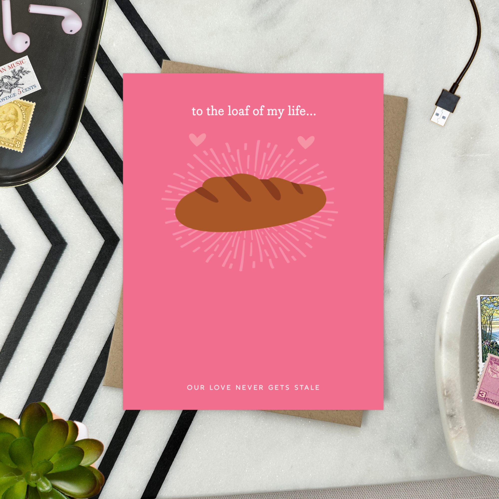 A Valentine's day greeting card with a illustration of a loaf of bread and the text 'to the loaf of my life... Our love never gets stale.'
