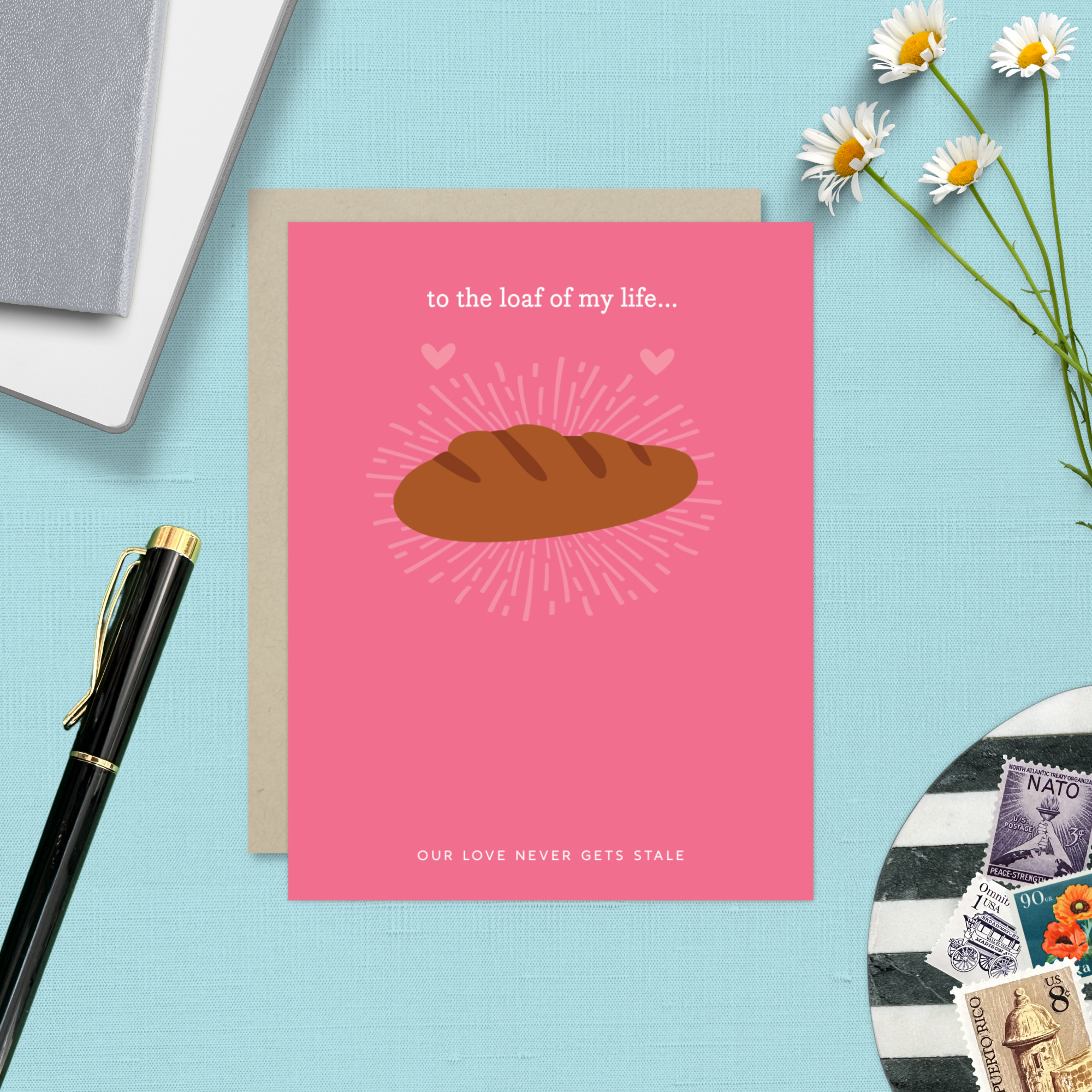 A Valentine's day greeting card with a illustration of a loaf of bread and the text 'to the loaf of my life... Our love never gets stale.'