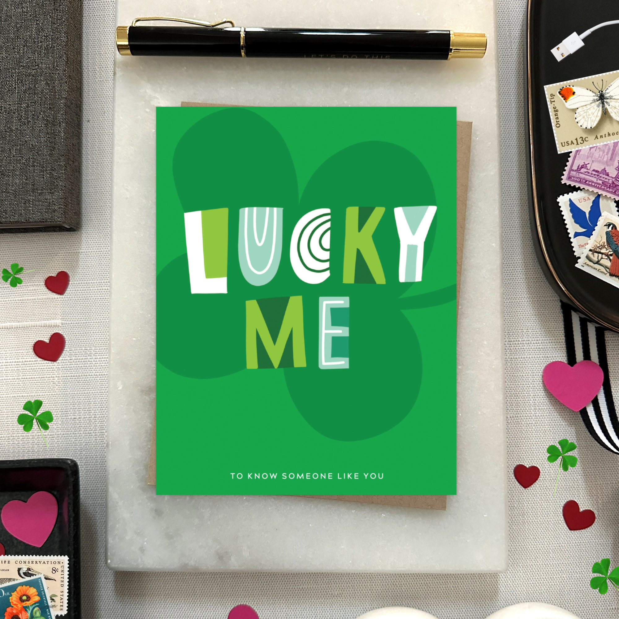 A st. patricks day greeting card with the text 'LUCKY ME' accompanied by the phrase 'TO KNOW SOMEONE LIKE YOU' on a background featuring a four-leaf clover