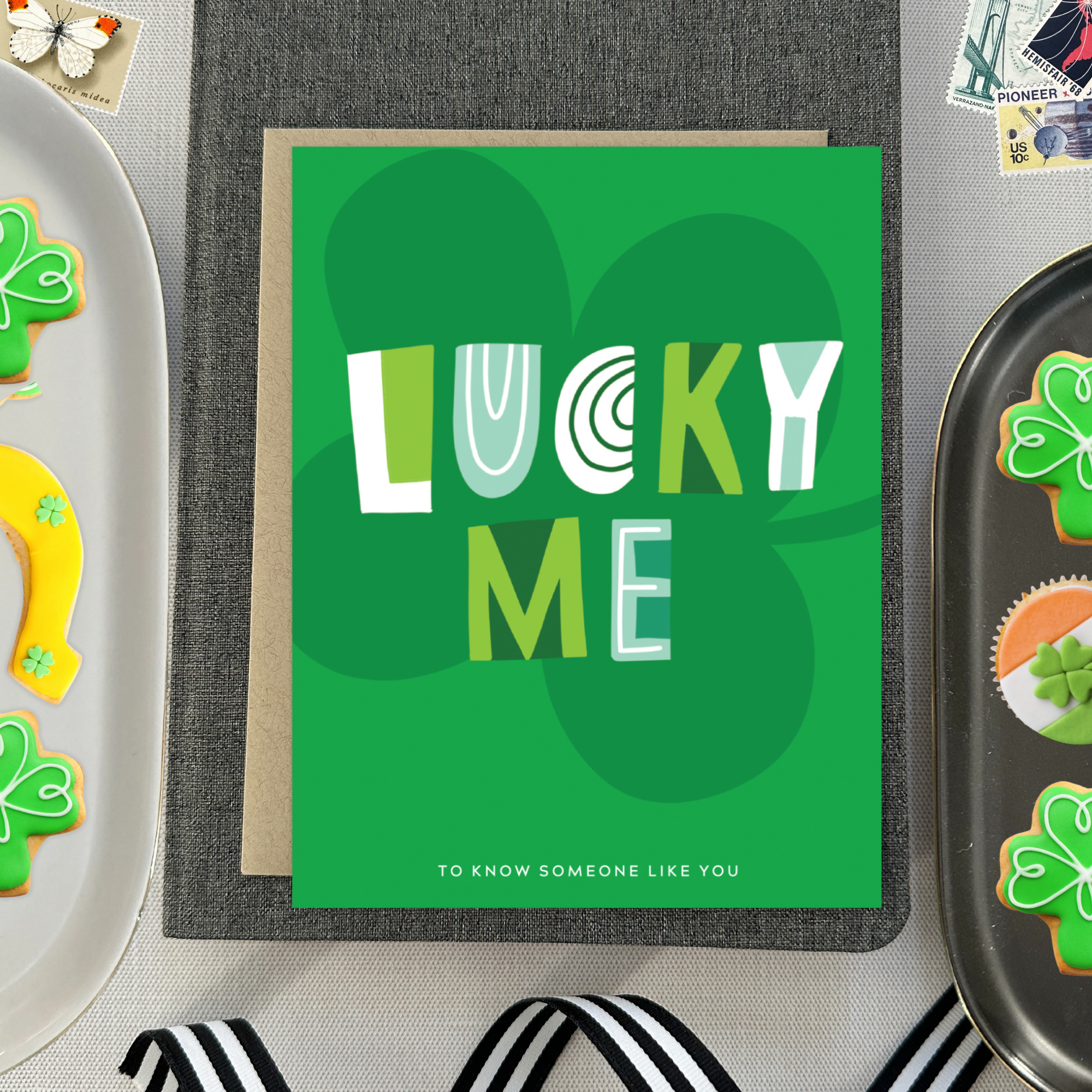 A st. patricks day greeting card with the text 'LUCKY ME' accompanied by the phrase 'TO KNOW SOMEONE LIKE YOU' on a background featuring a four-leaf clover