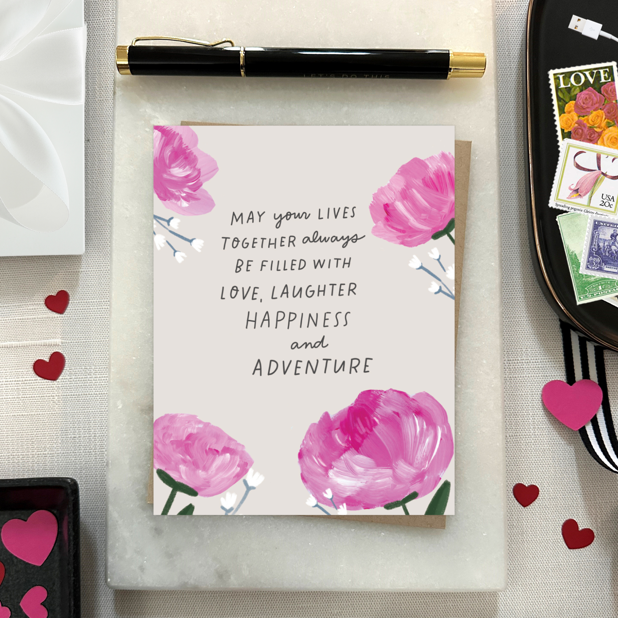 A wedding greeting card with hand-painted hydrangeas and a handwritten message.