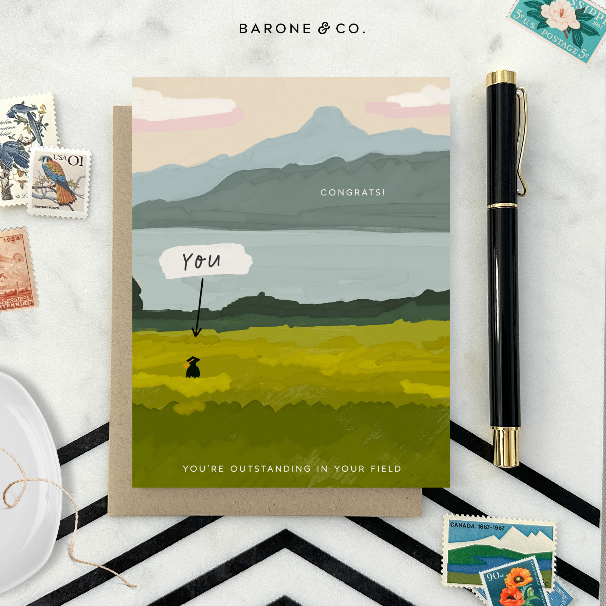 Graduation greeting card with person out standing in their field with a narrow pointing to them that says 'you'