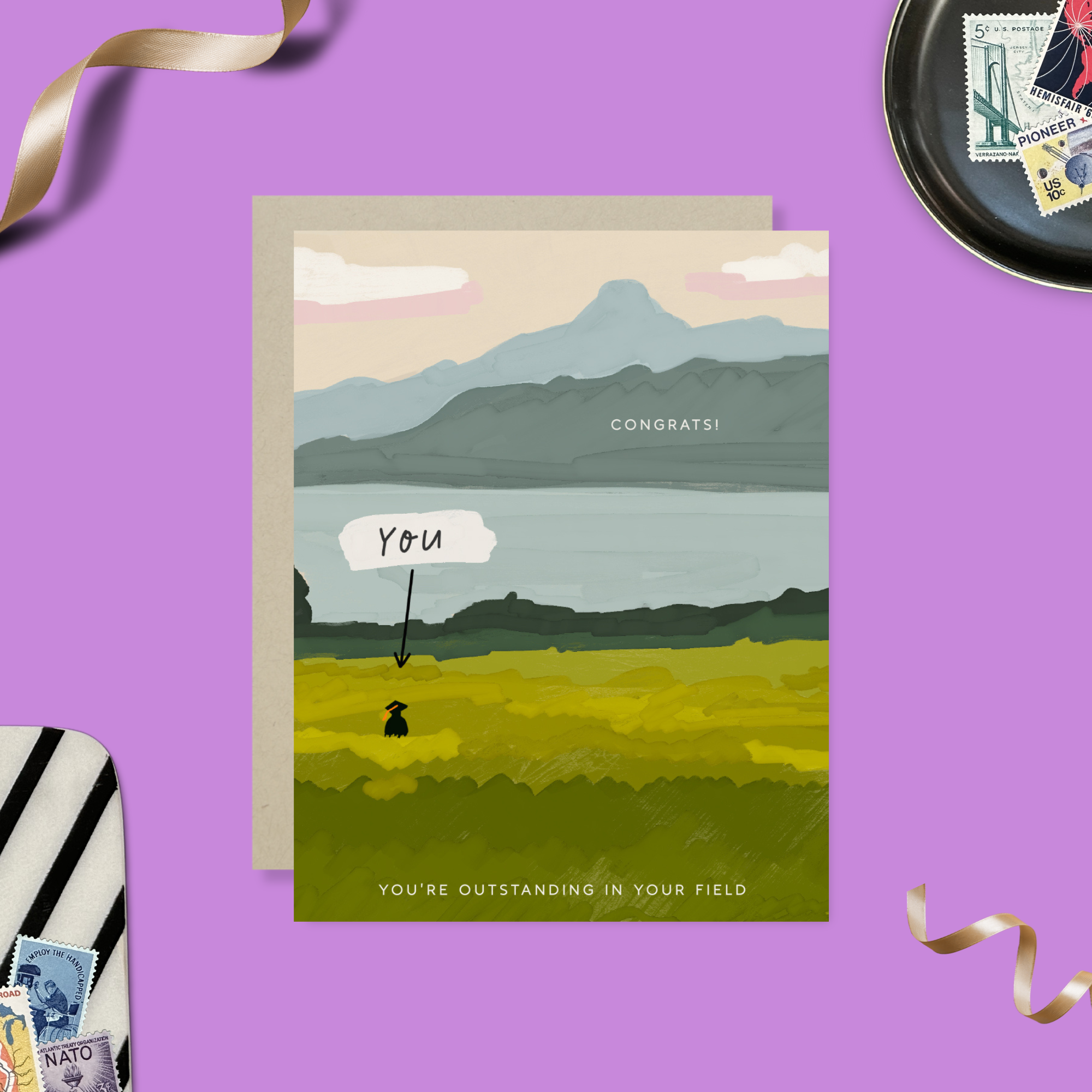 Graduation greeting card with person out standing in their field with a narrow pointing to them that says 'you'