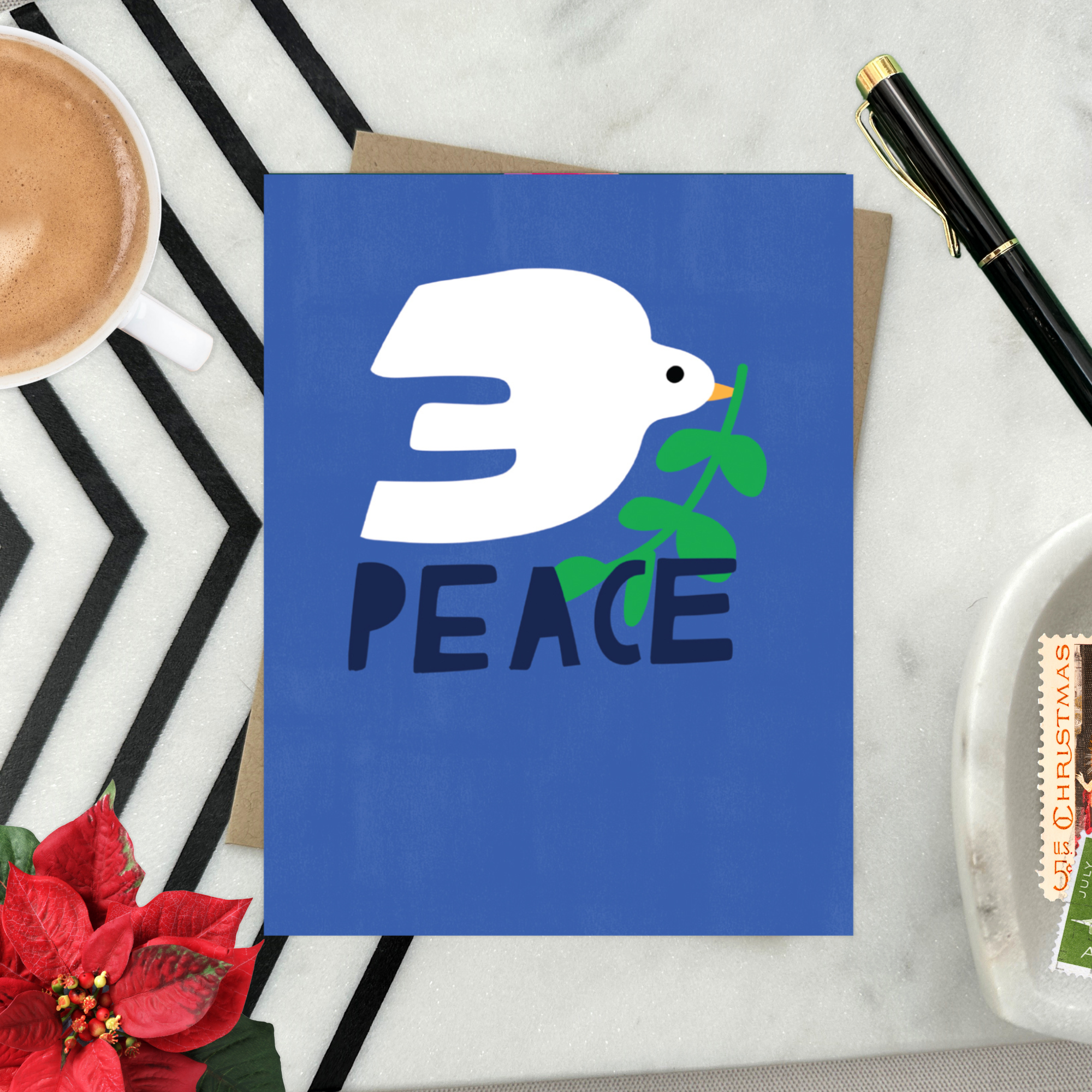 hand-painted holiday reeting card with a blue background featuring a white bird and the word 'PEACE' in capital letters.