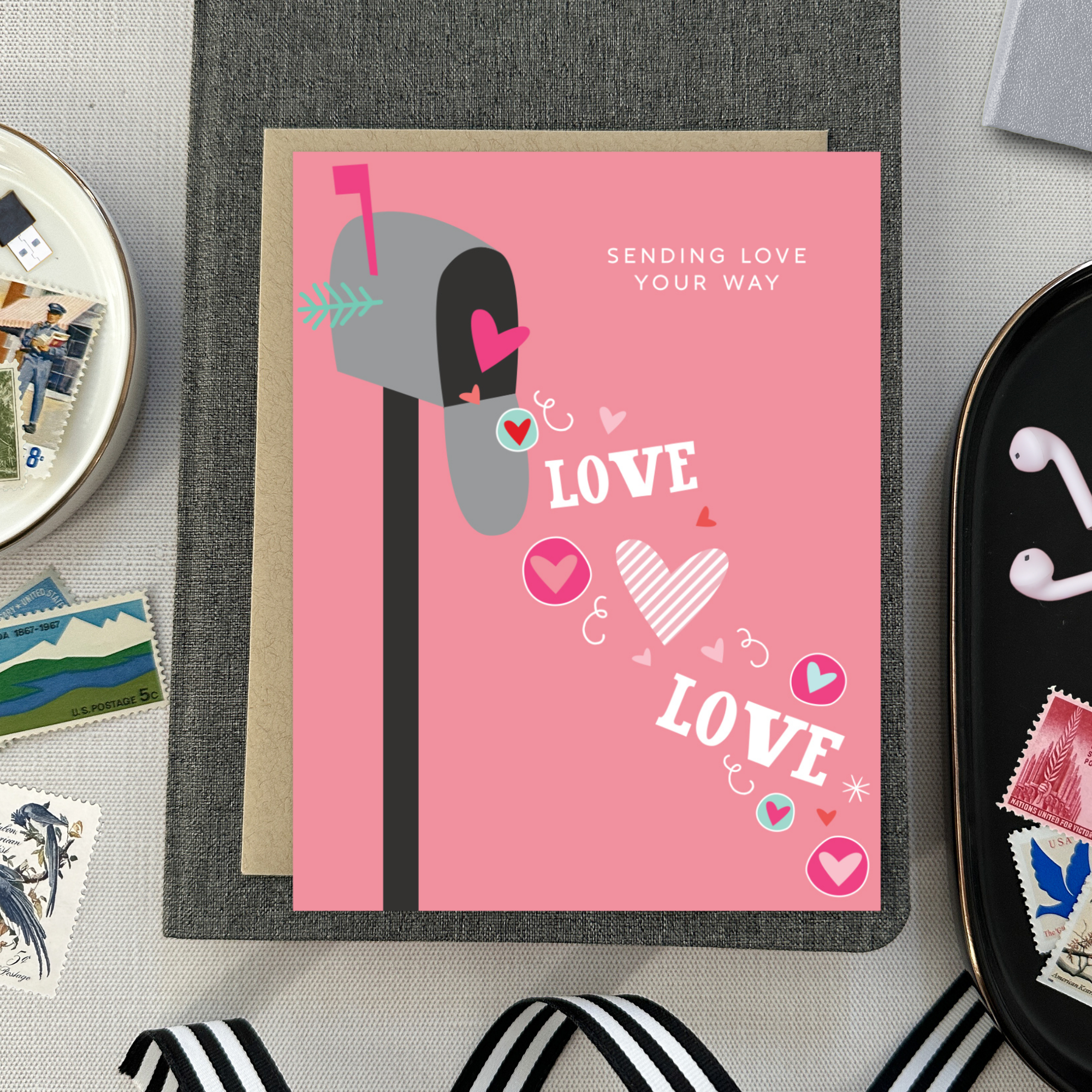 A Valentine's Day greeting card featuring a whimsical mailbox overflowing with love and playful hearts