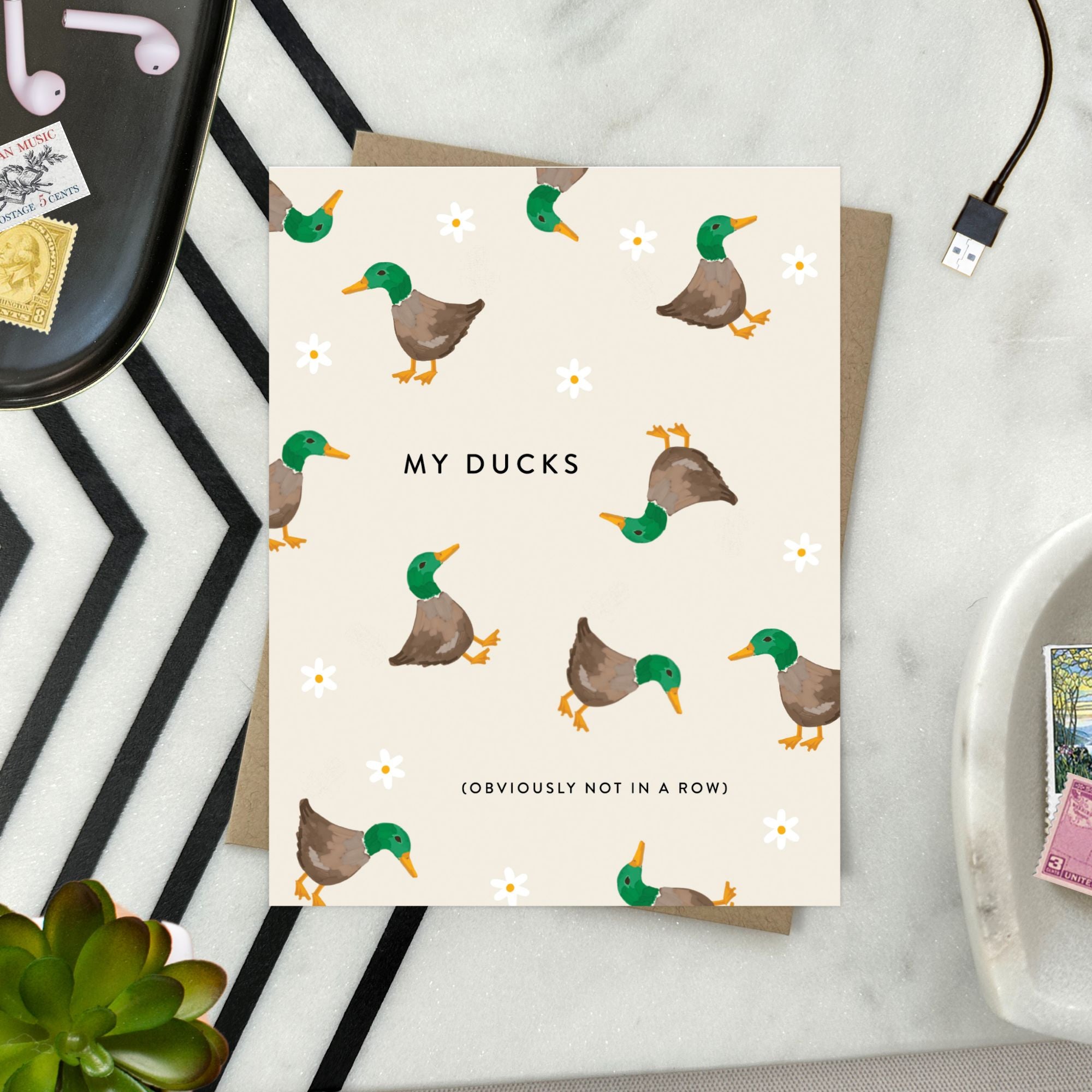 Funny greeting card with illustration of chaotic ducks and humorous text about letting go of perfection