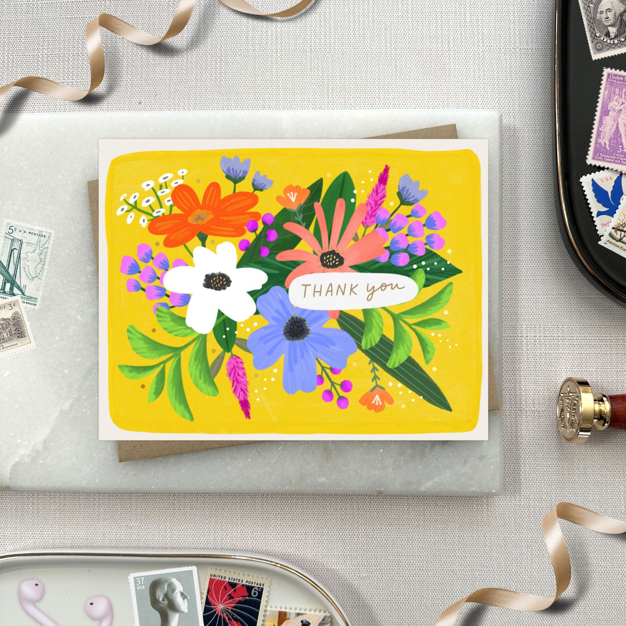 Thank You Greeting card featuring colorful illustrated flowers.