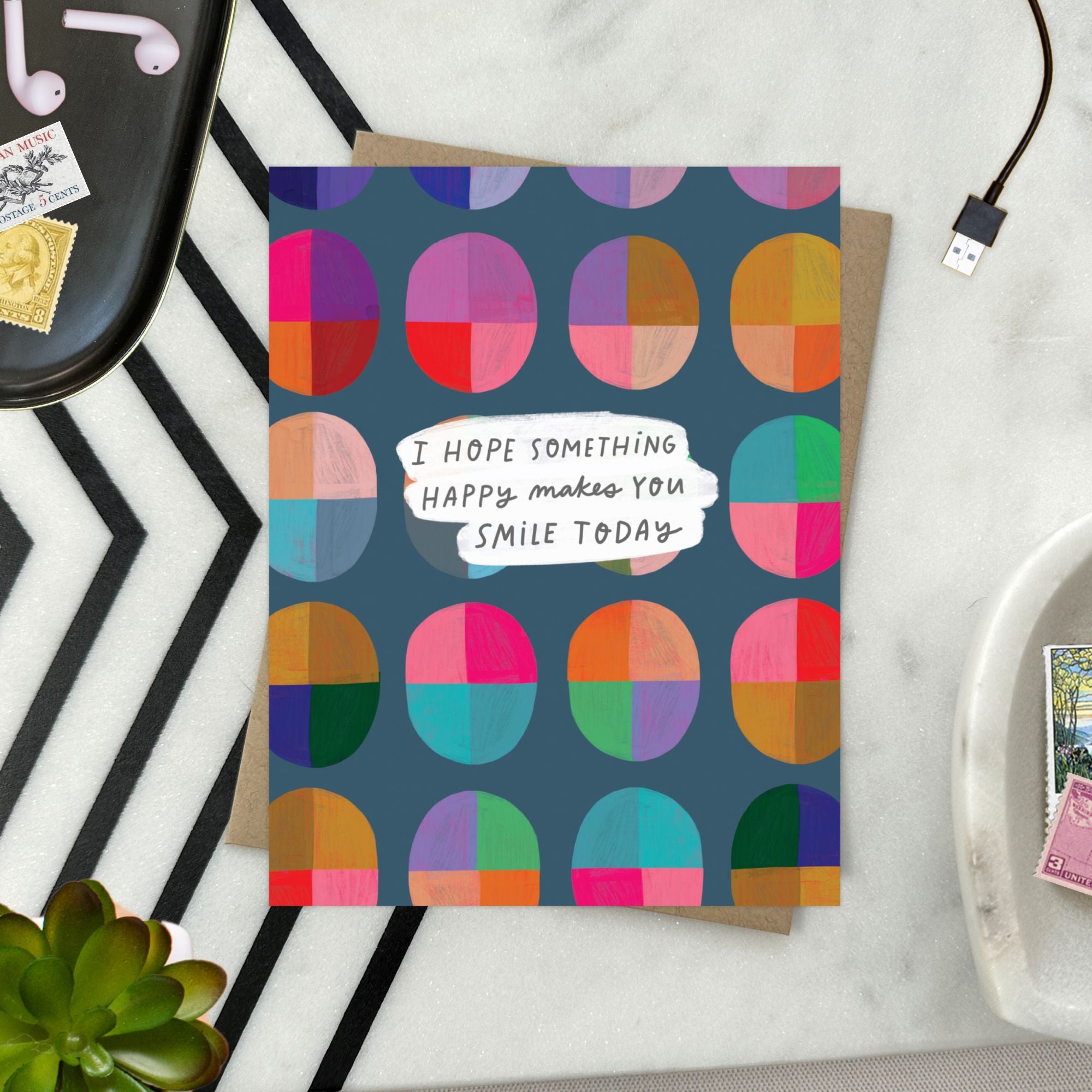 Uplifting greeting card with cheerful message “I hope something happy makes you smile today” and bright, colorful design
