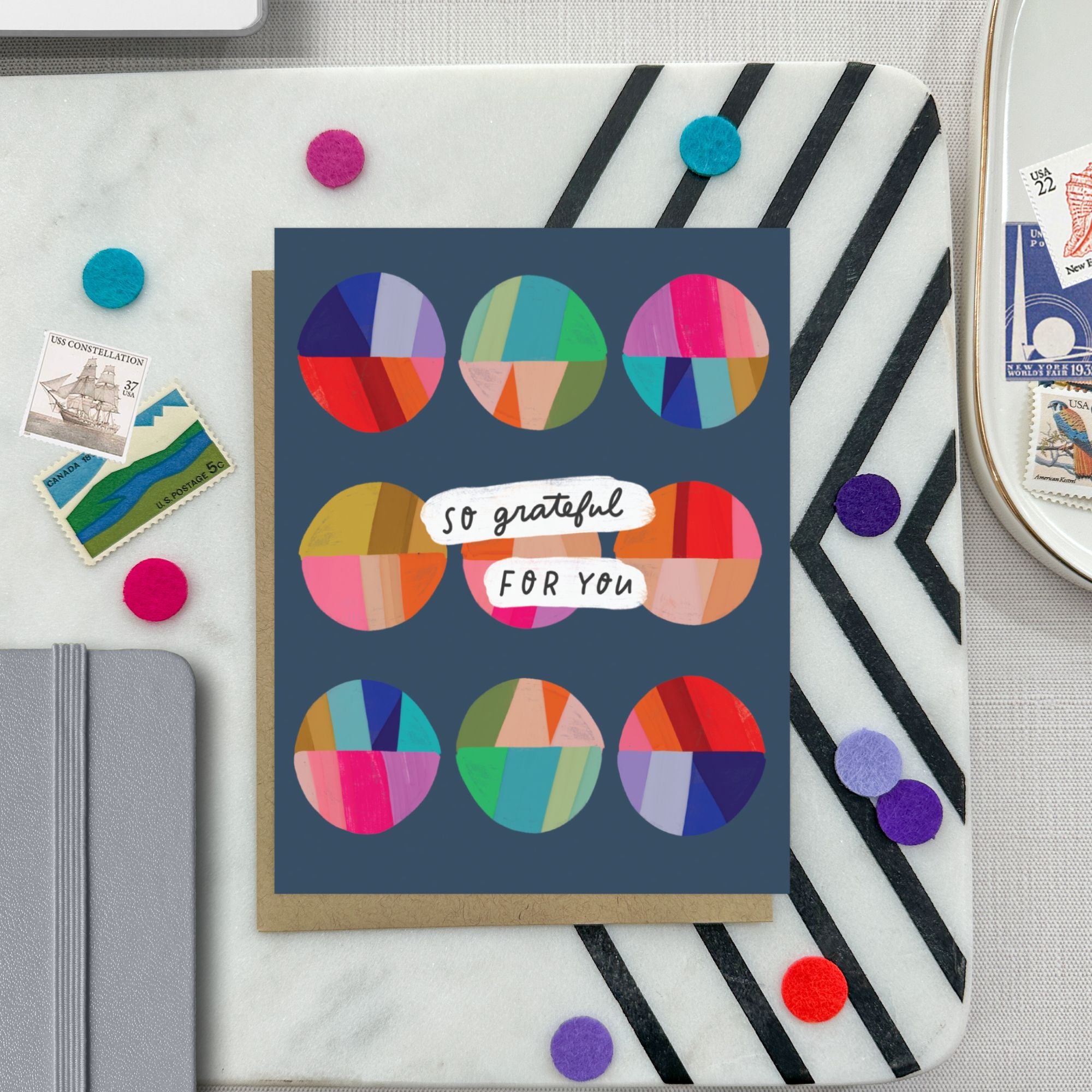 Thank you greeting card featuring a grid of colorful, hand-painted patchwork circles and the handwritten words So Grateful for You.