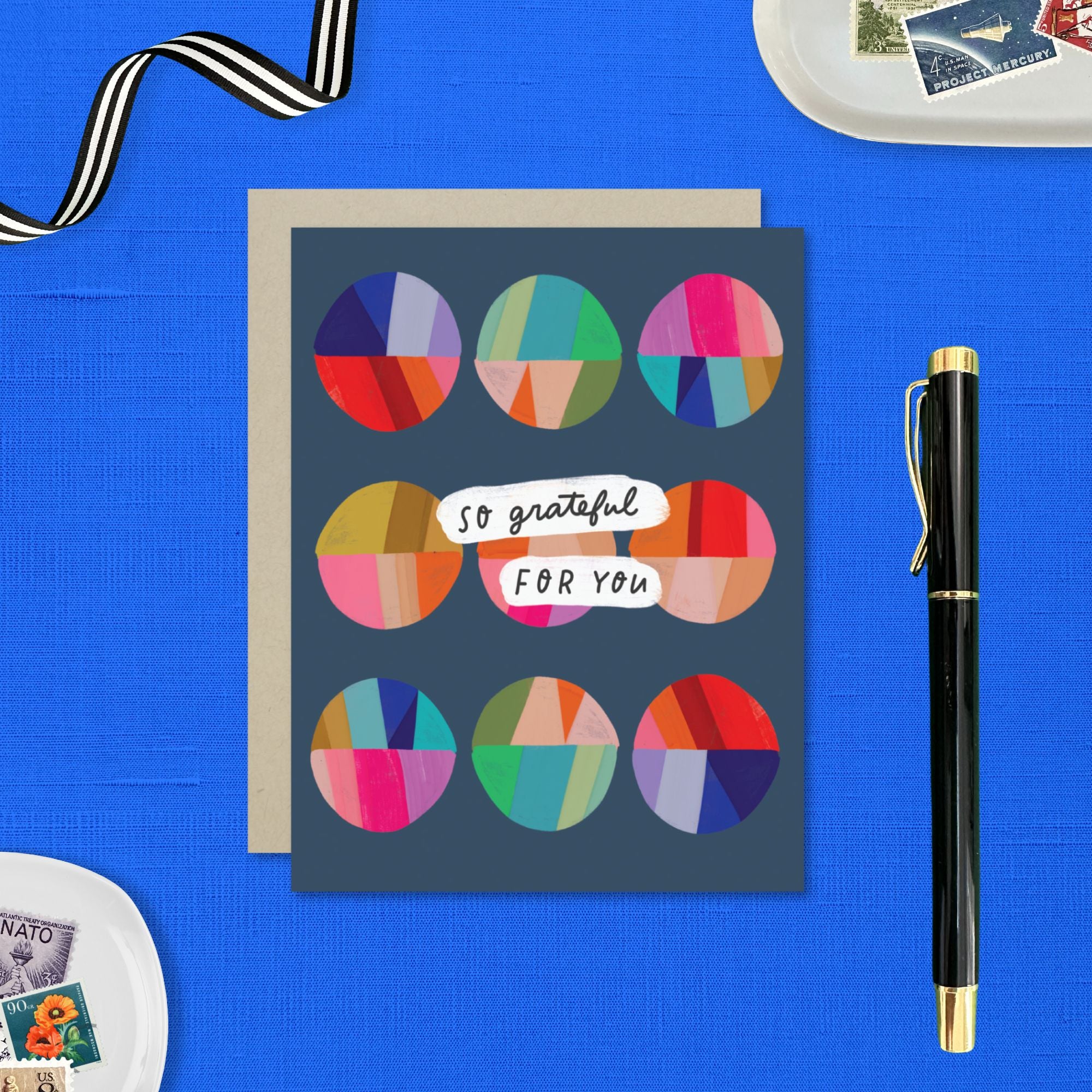 Thank you greeting card featuring a grid of colorful, hand-painted patchwork circles and the handwritten words So Grateful for You.