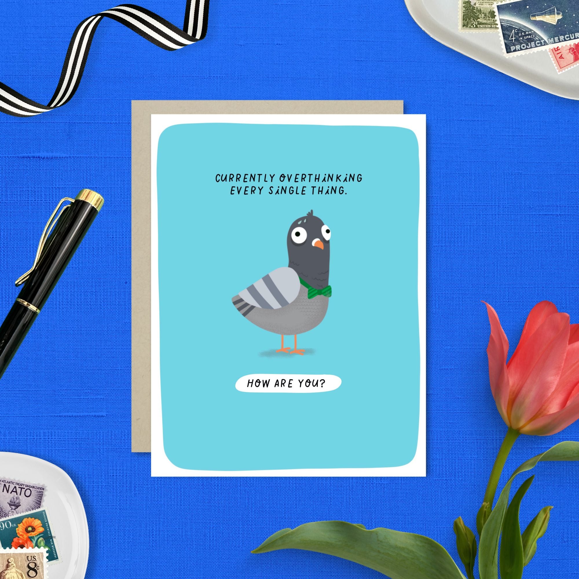 Greeting card with illustrated pigeon and text that reads “Currently overthinking every single thing. How are you?”
