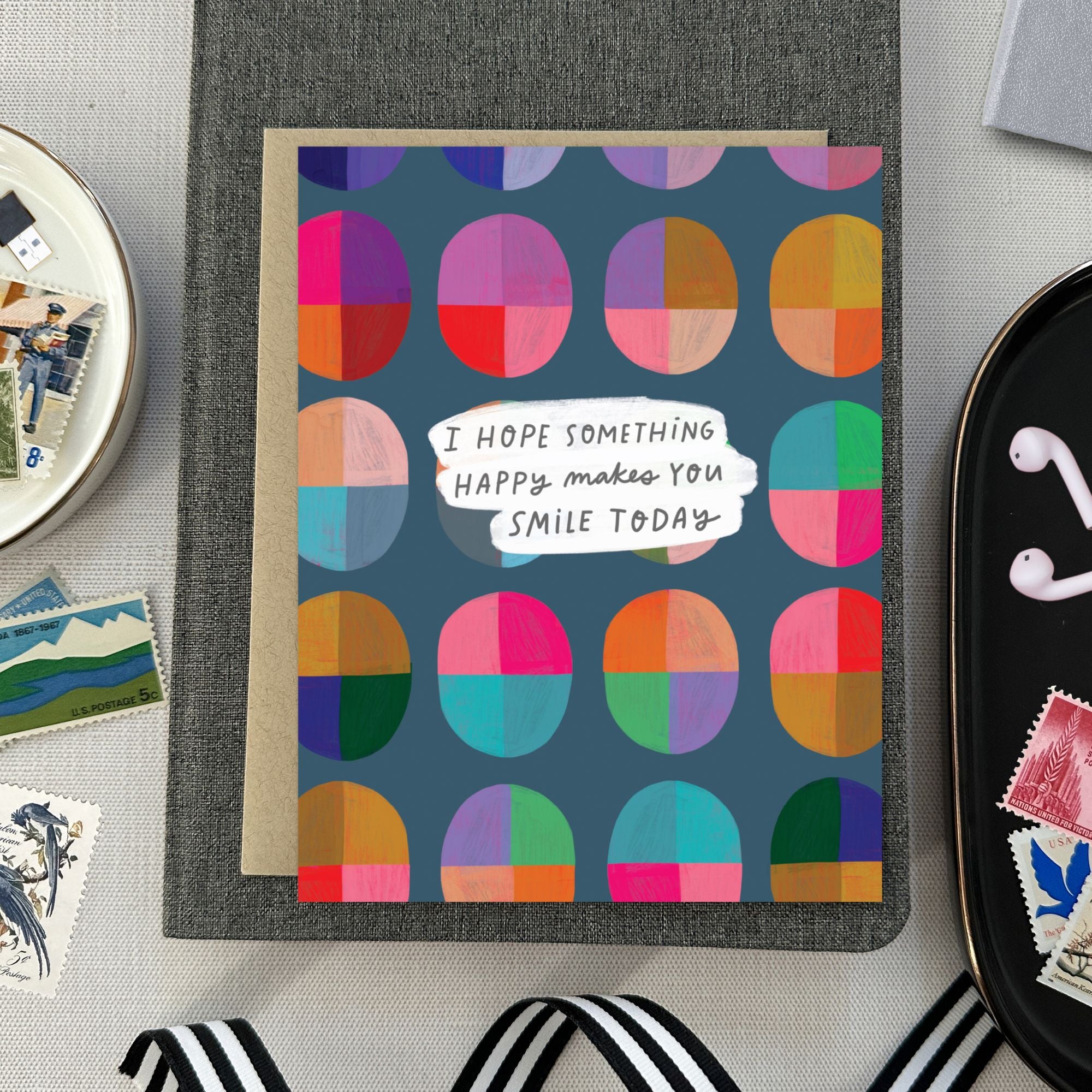 Uplifting greeting card with cheerful message “I hope something happy makes you smile today” and bright, colorful design