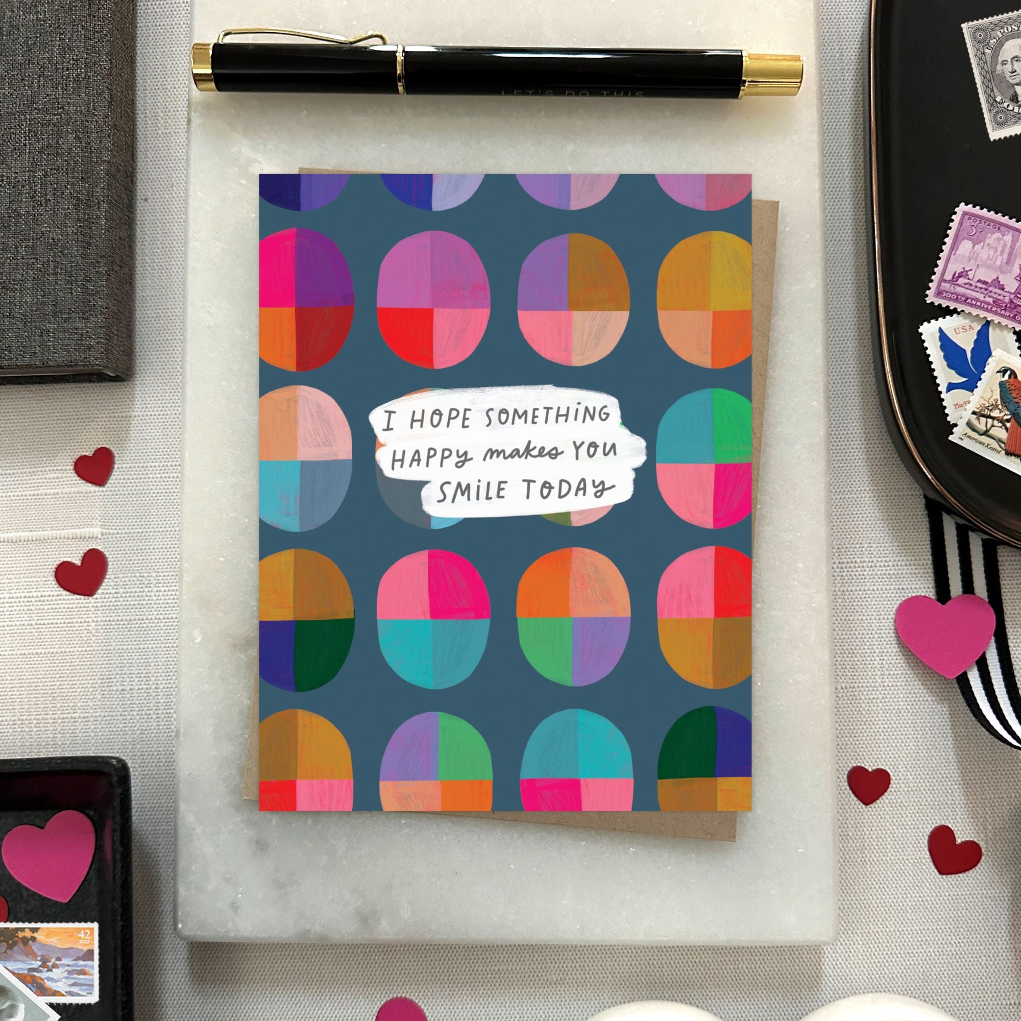 Uplifting greeting card with cheerful message “I hope something happy makes you smile today” and bright, colorful design