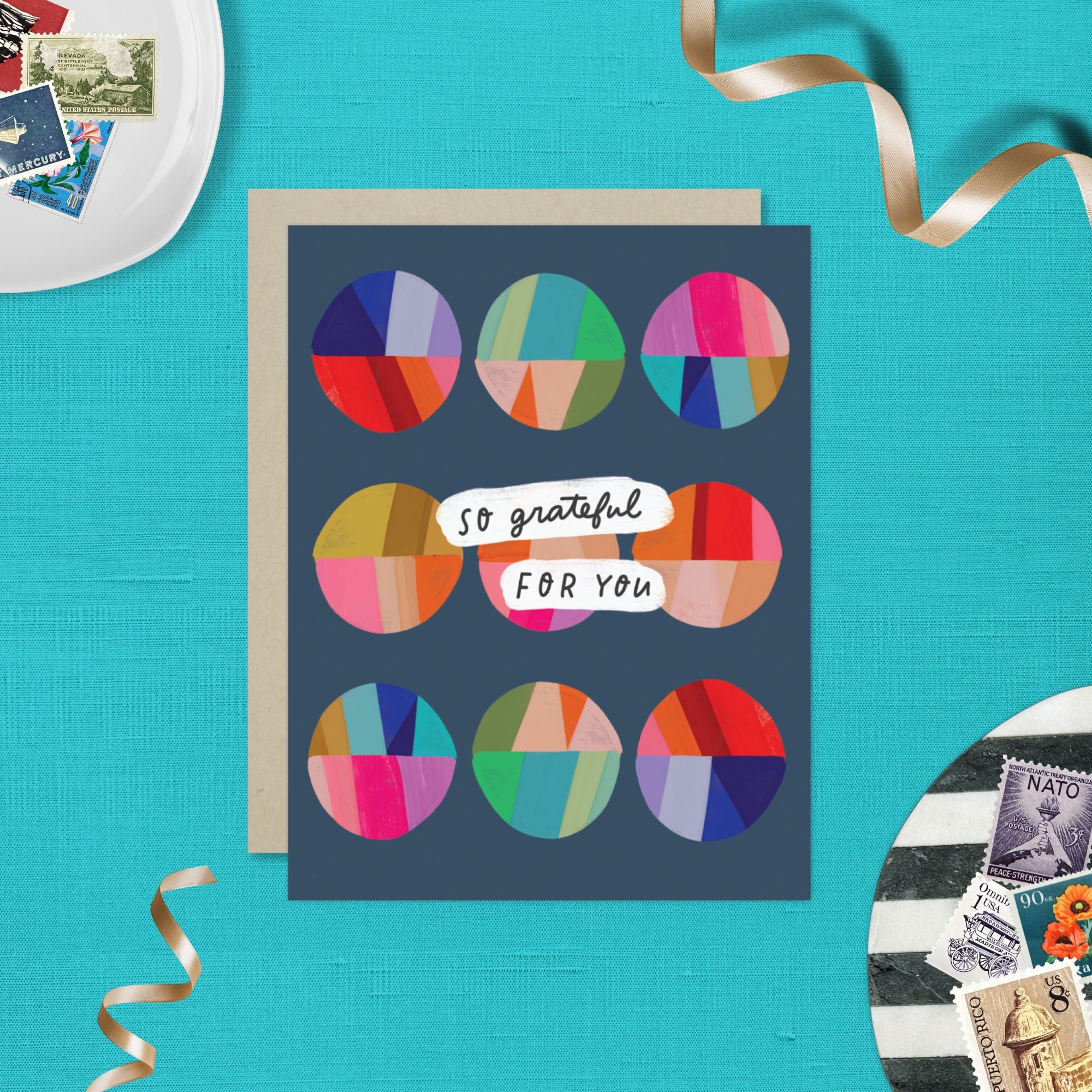 Thank you greeting card featuring a grid of colorful, hand-painted patchwork circles and the handwritten words So Grateful for You.