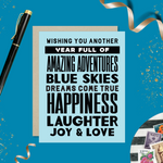 A birthday greeting card with blue background and black text, featuring stacked words and phrases like 'amazing adventures', 'blue skies', 'dreams come true', 'happiness', 'laughter', 'joy & love'