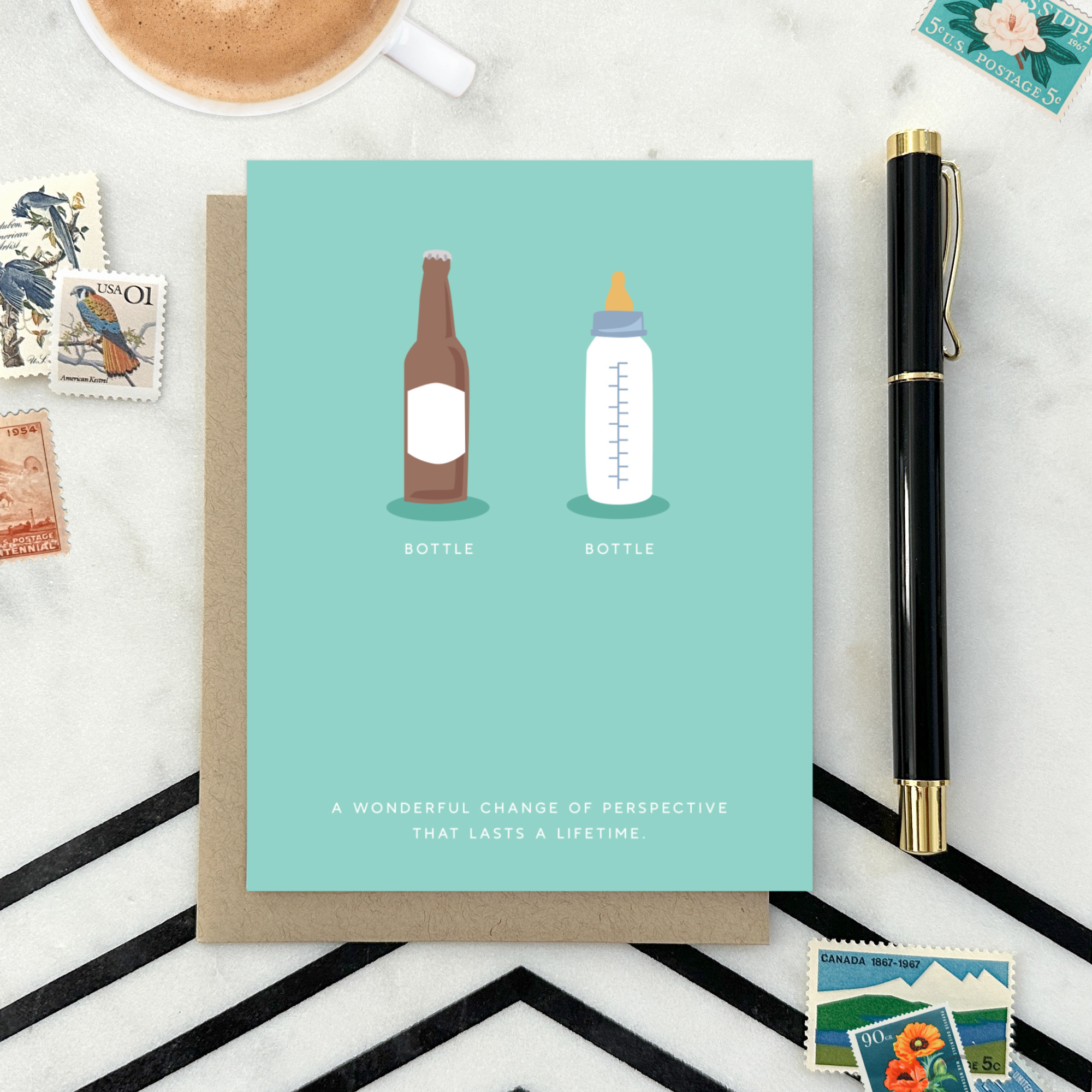 Baby greeting card with beer and baby bottle and 'a wonderful change of perspective that lasts a lifetime' text