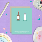 Baby greeting card with beer and baby bottle and 'a wonderful change of perspective that lasts a lifetime' text