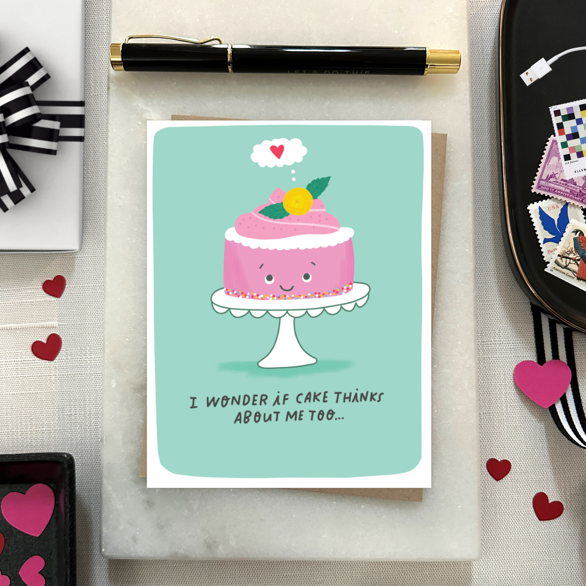 Birthday greeting card with a cartoon cake which says" I wonder if cake thinks about me too.."