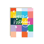 Modern birthday card with hand-lettered 'Happy Birthday' over a colorful color-block grid.