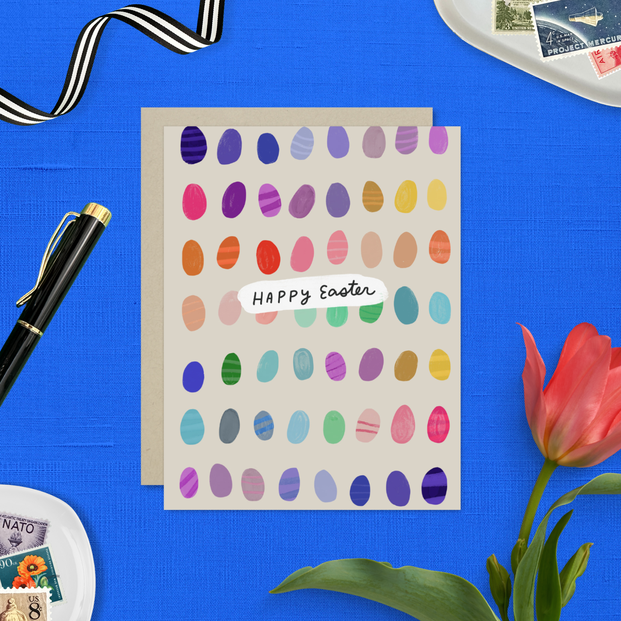Easter greeting card with colorful eggs in the background with 'happy easter text'