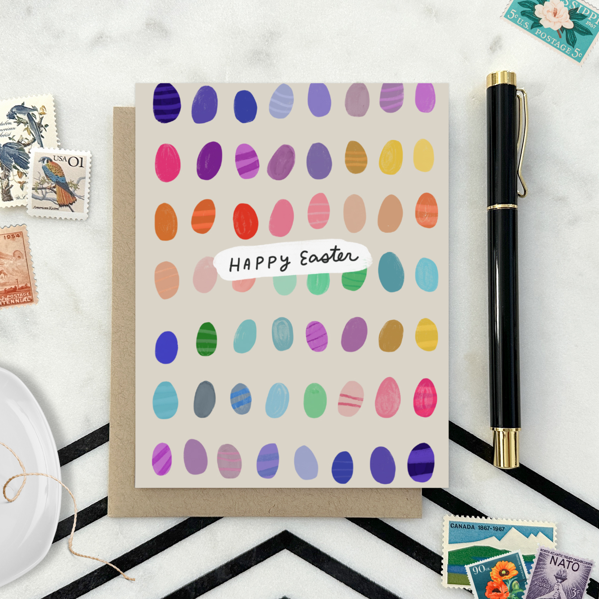 Easter greeting card with colorful eggs in the background with 'happy easter text'