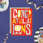 A colorful congratulations greeting card with the word 'CONGRATULATIONS' written in bold, playful lettering, predominantly in red, with additional decorative elements like stars.
