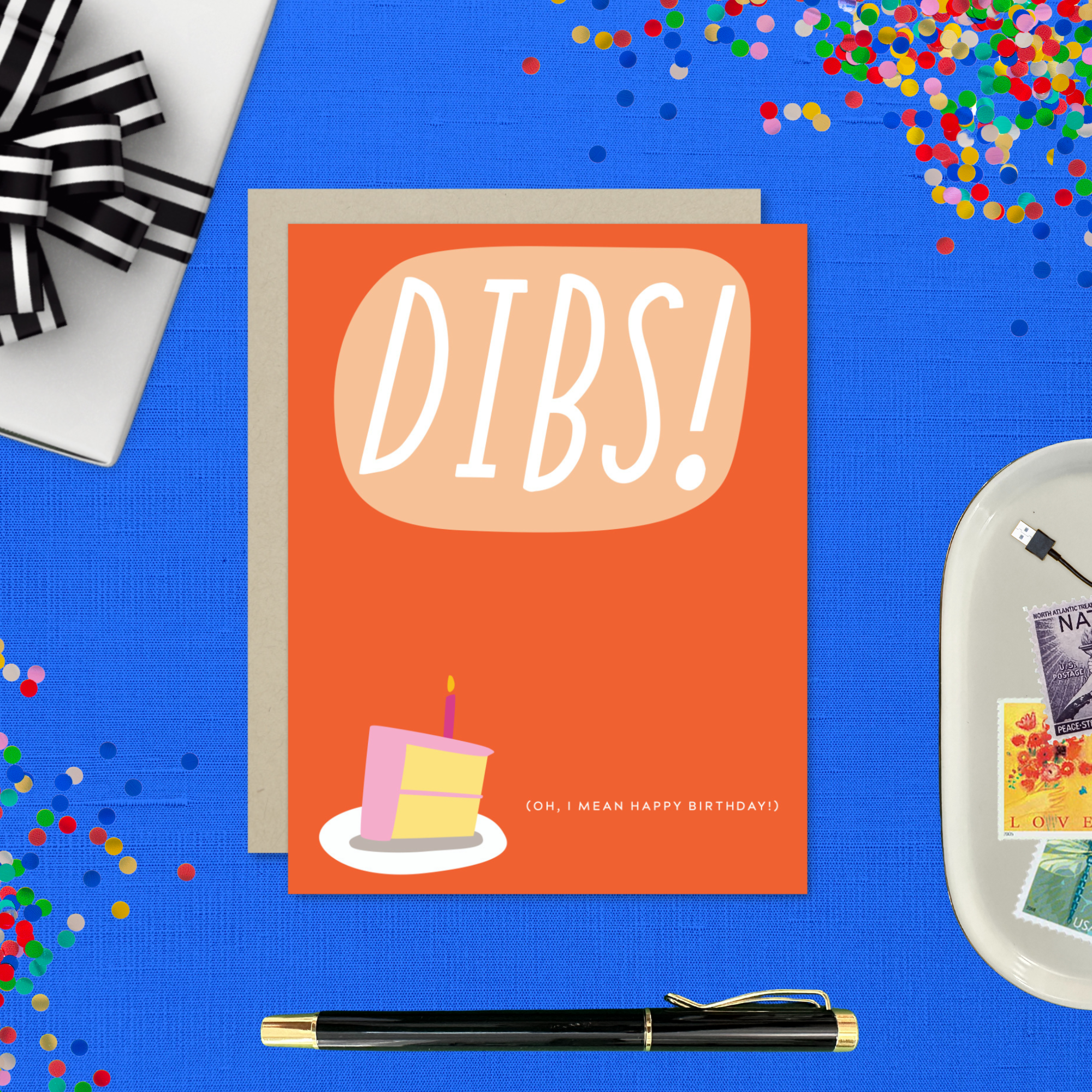 Card with 'DIBS! (Oh, I mean happy birthday! )' text and a cake illustration on an orange background.
